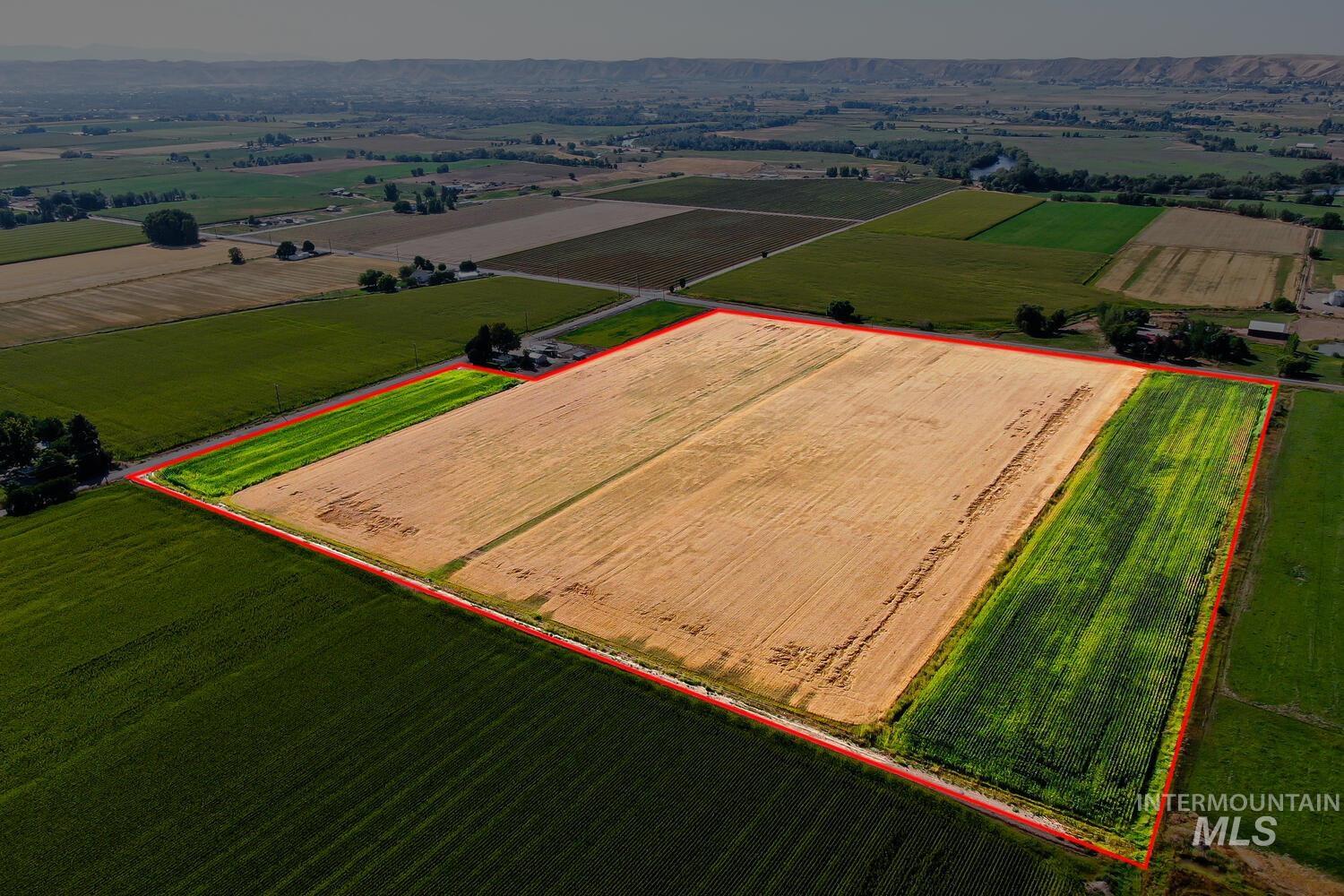 Overview of rural landscape with large plots for crops and property boundaries highlighted