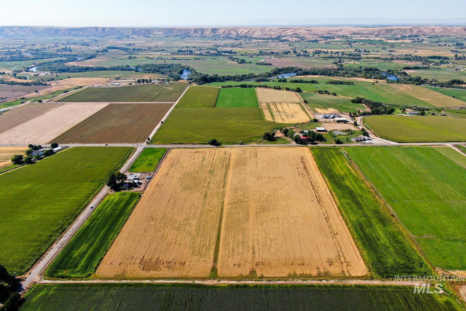 View of rural area featuring large plots for crops