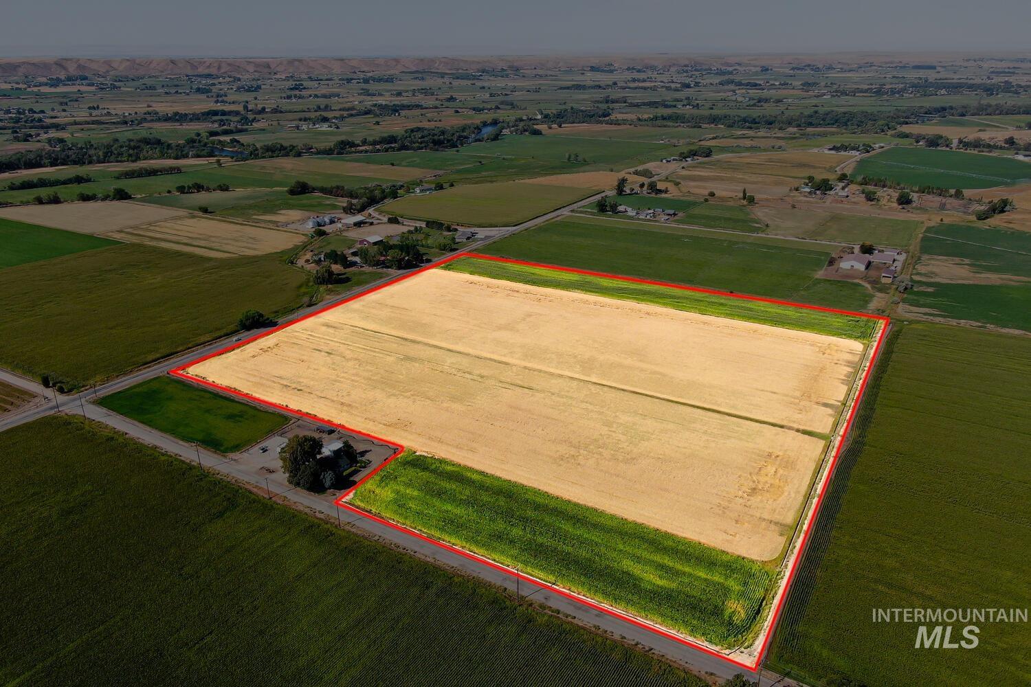 View of rural area with property parcel outlined and farmland