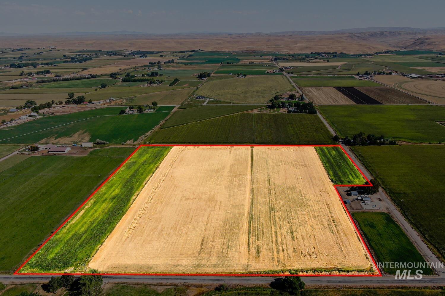 Aerial view of sparsely populated area with abundant farmland and property boundaries highlighted