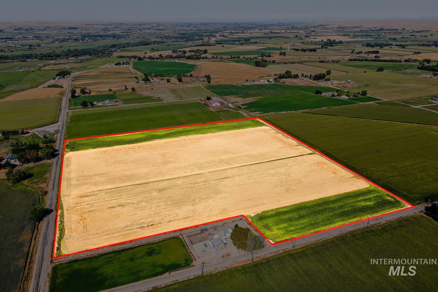 Overview of rural landscape featuring abundant farmland and property parcel outlined