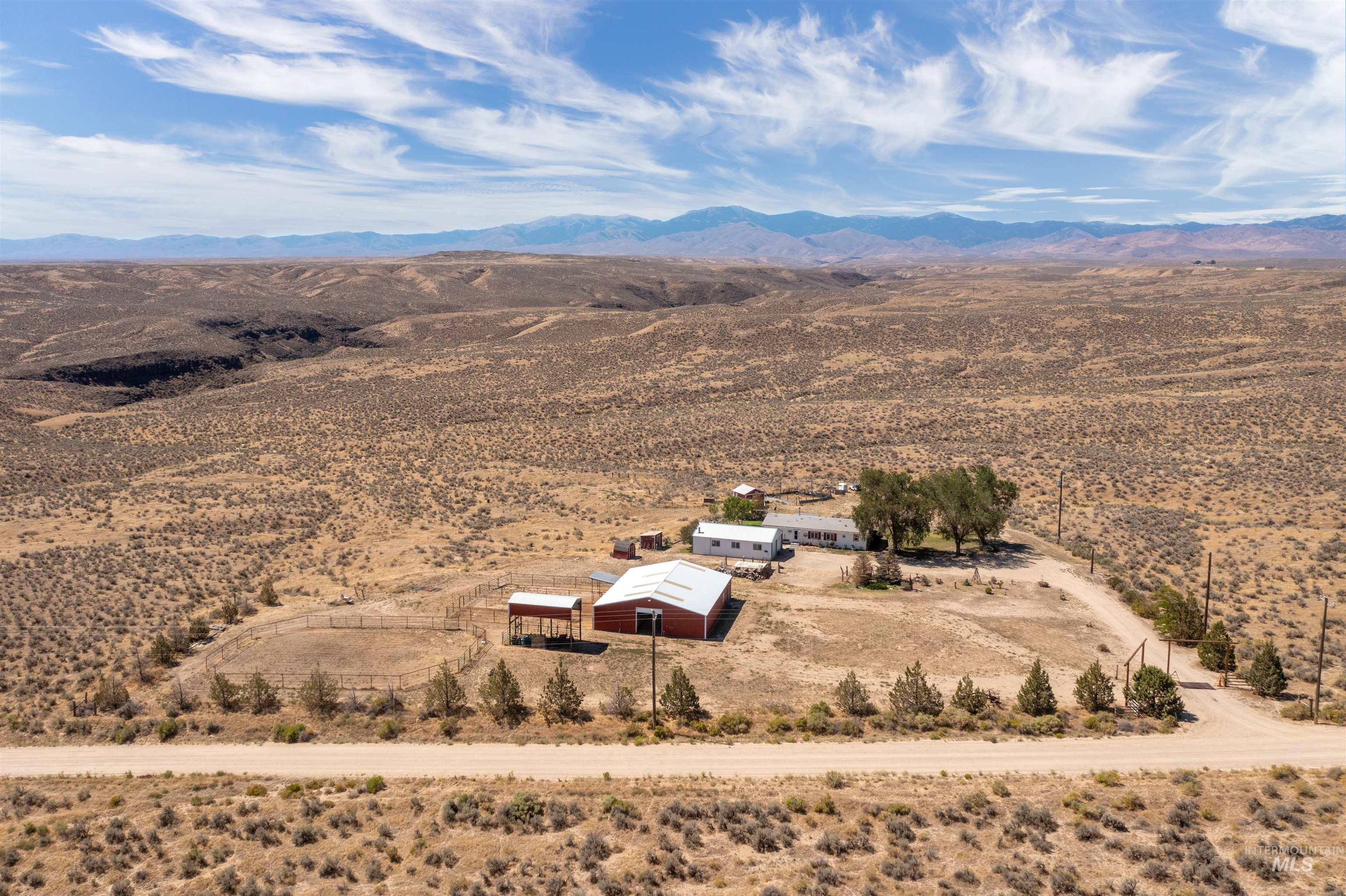 Overview of rural landscape featuring a mountainous background and a desert landscape