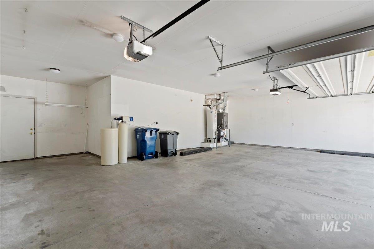 Garage with a garage door opener and water heater