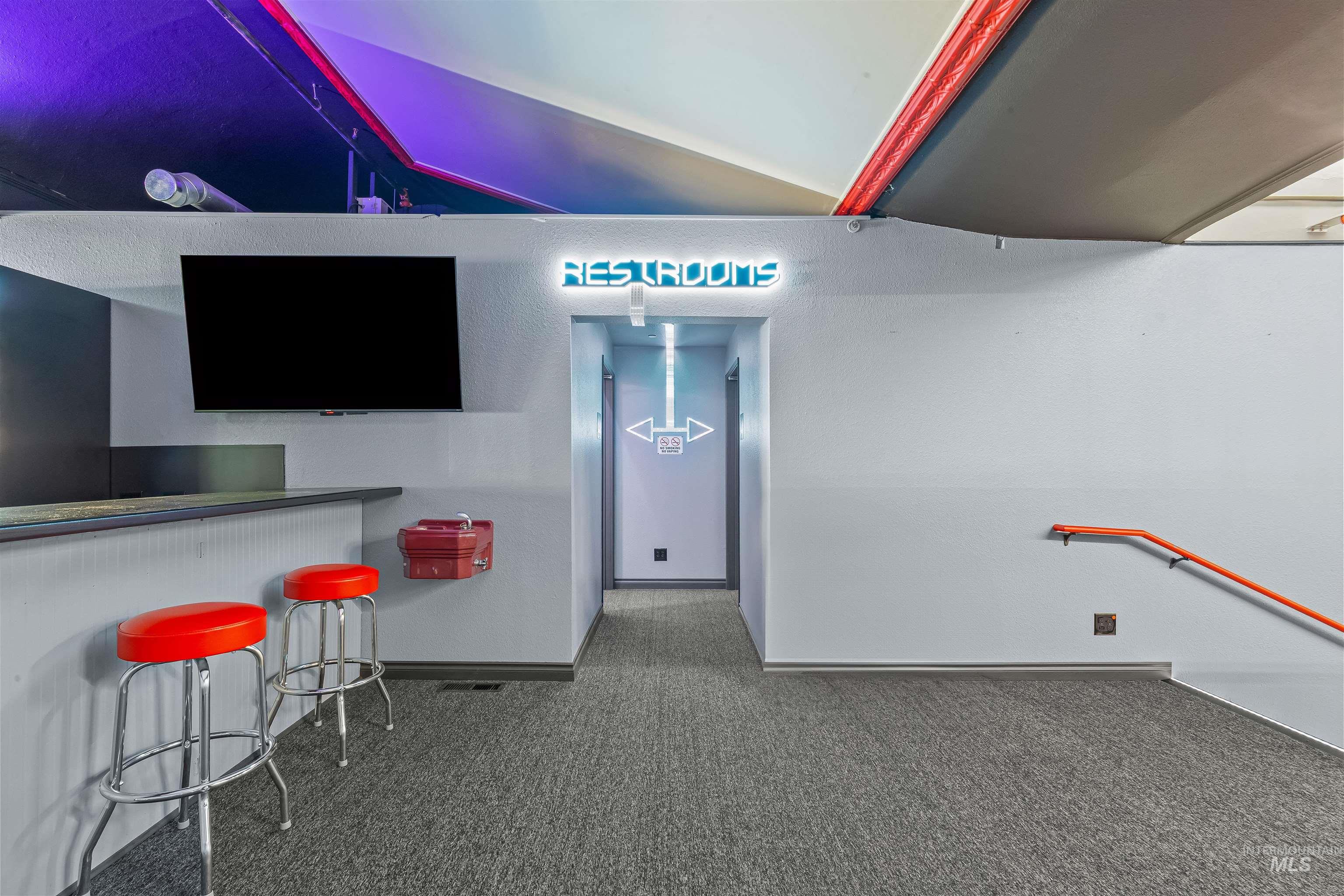 Bar with carpet floors and baseboards