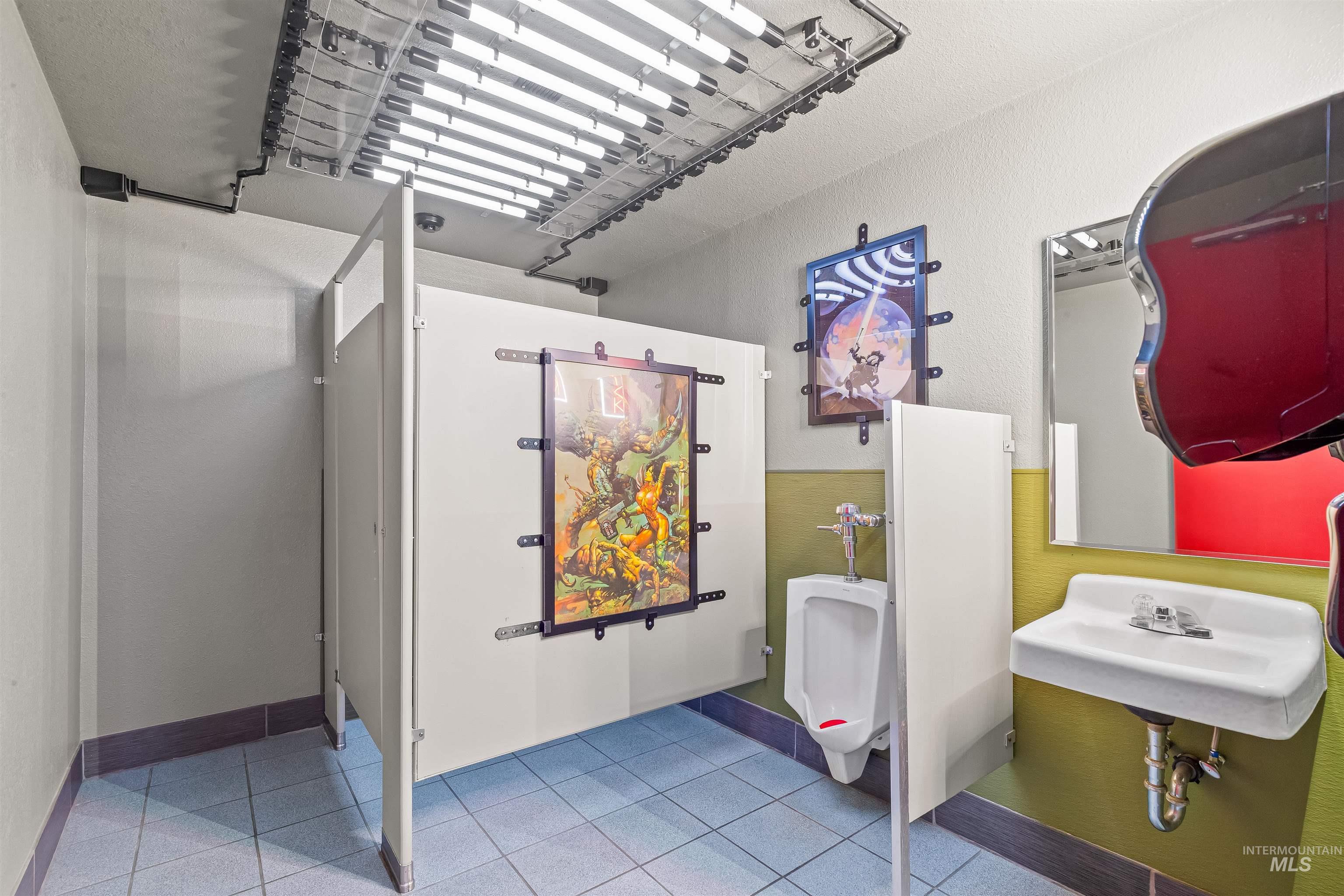 Bathroom with light tile patterned flooring and toilet