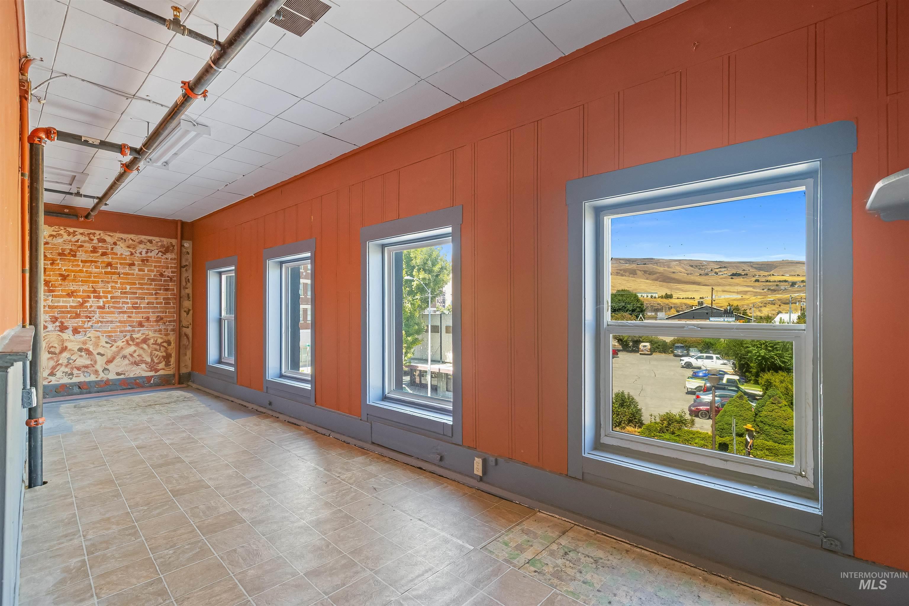 Empty room featuring wooden walls