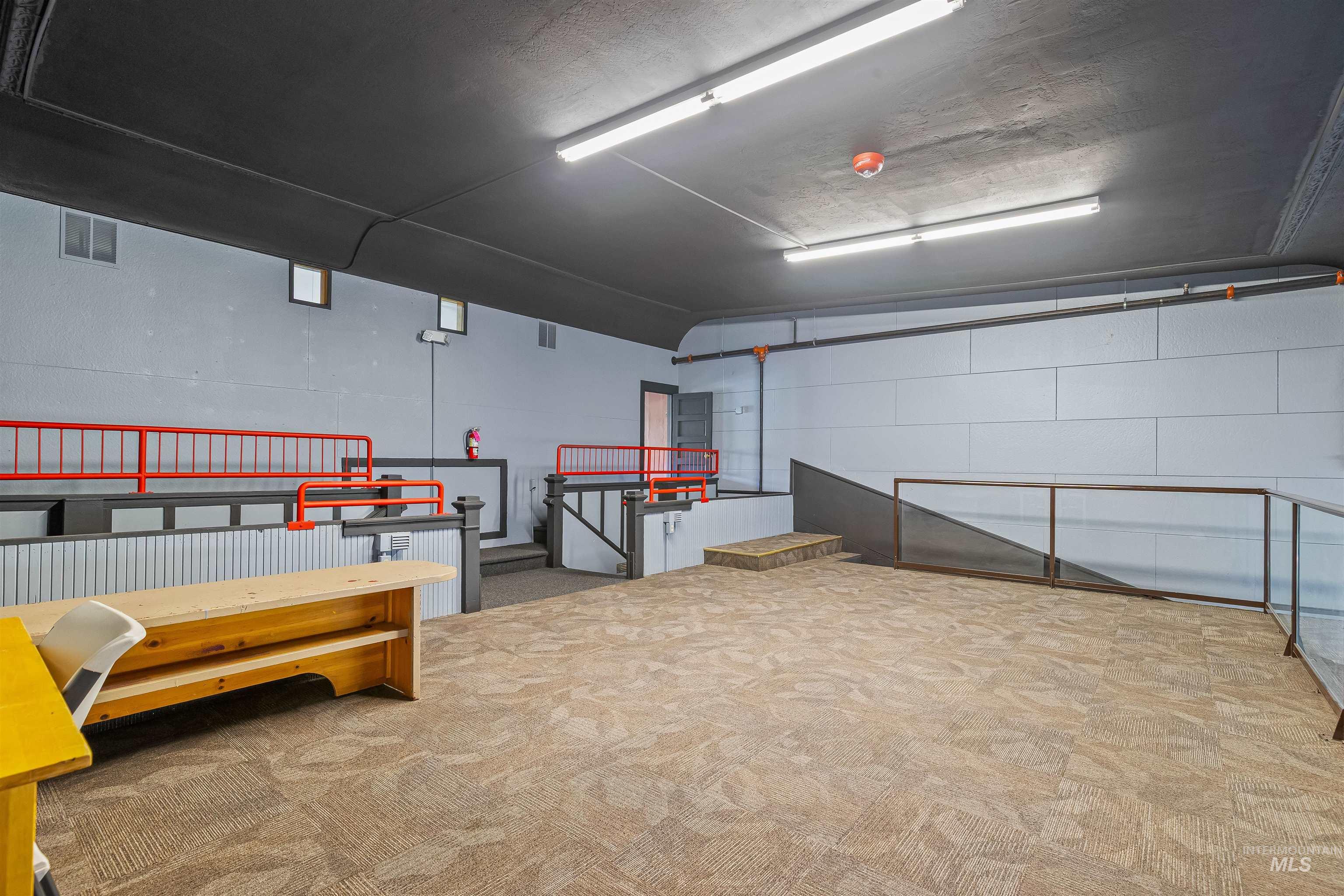 Garage featuring concrete block wall
