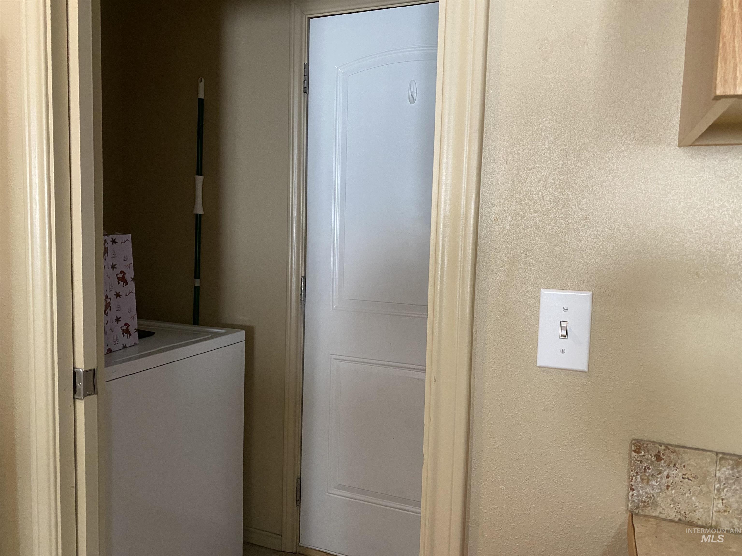 Laundry room featuring washer / clothes dryer