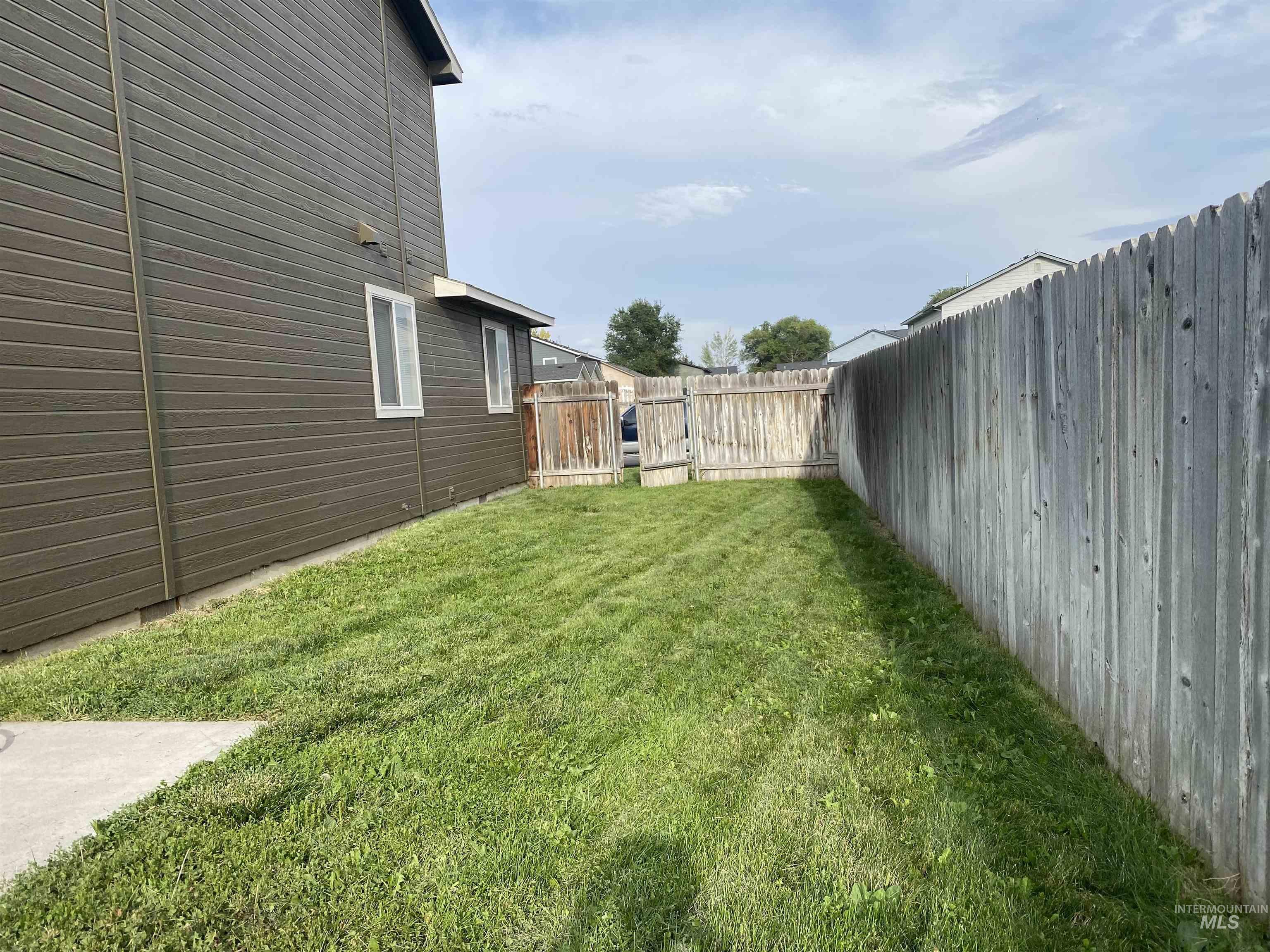 View of fenced backyard