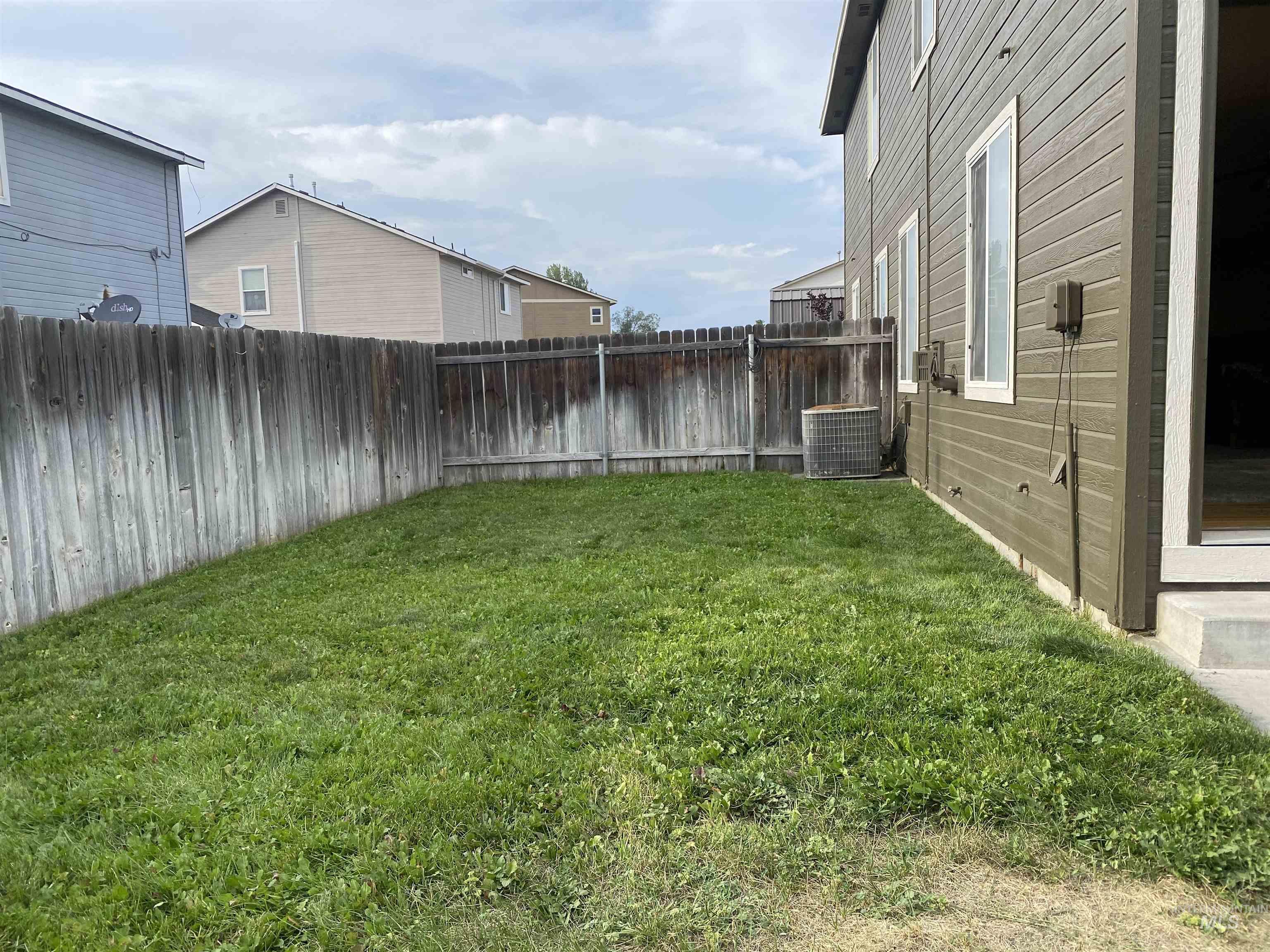 View of fenced backyard