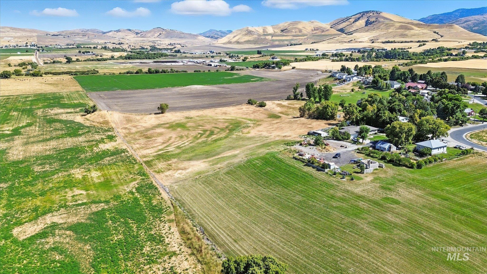Aerial overview of property's location featuring mountains and rural landscape