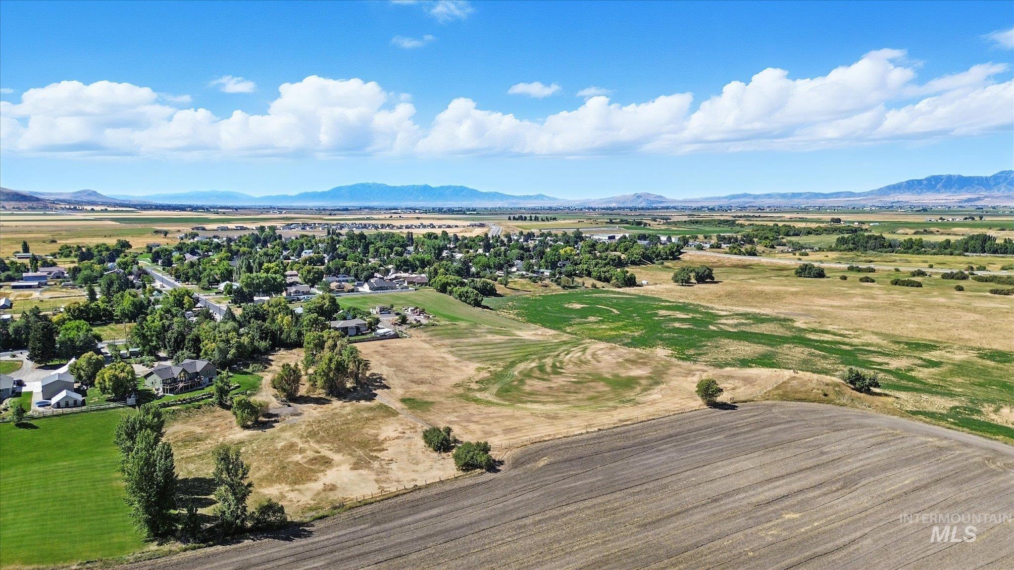 Drone / aerial view of mountains and a golf club