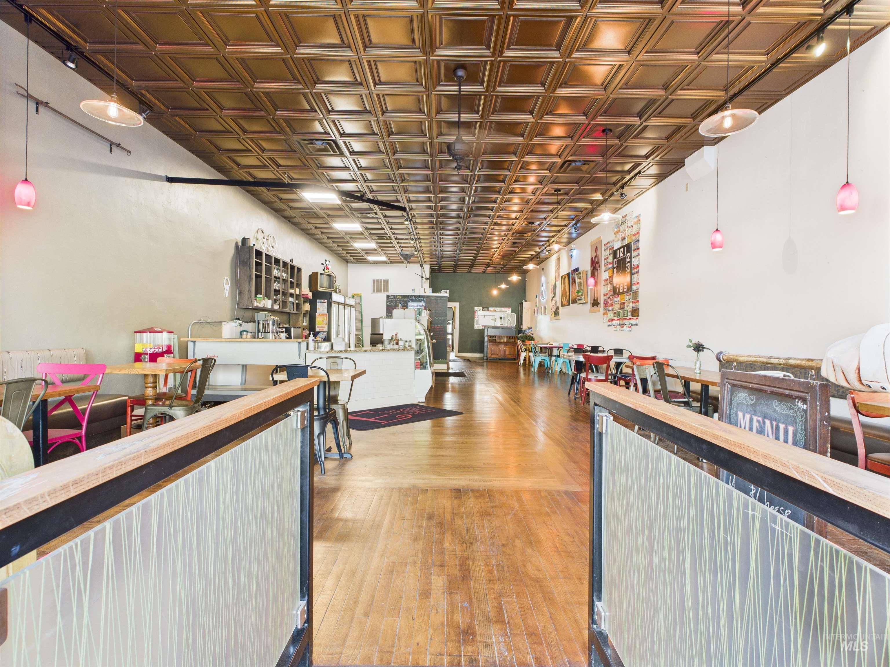 Reception area featuring an ornate ceiling and a community bar