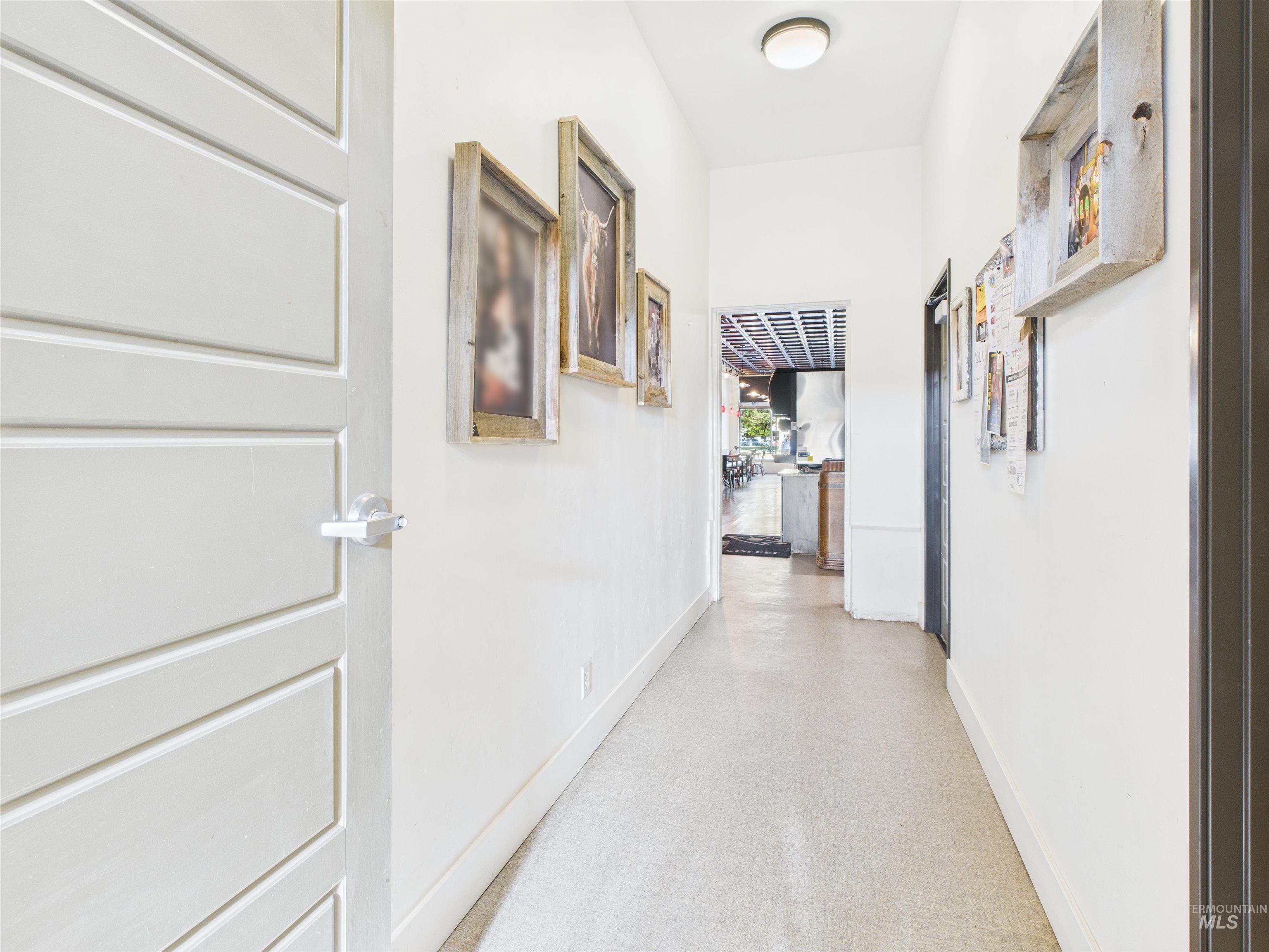 Corridor featuring baseboards