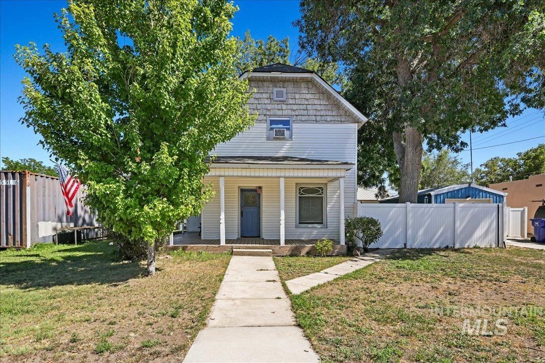 View of front of house with covered porch