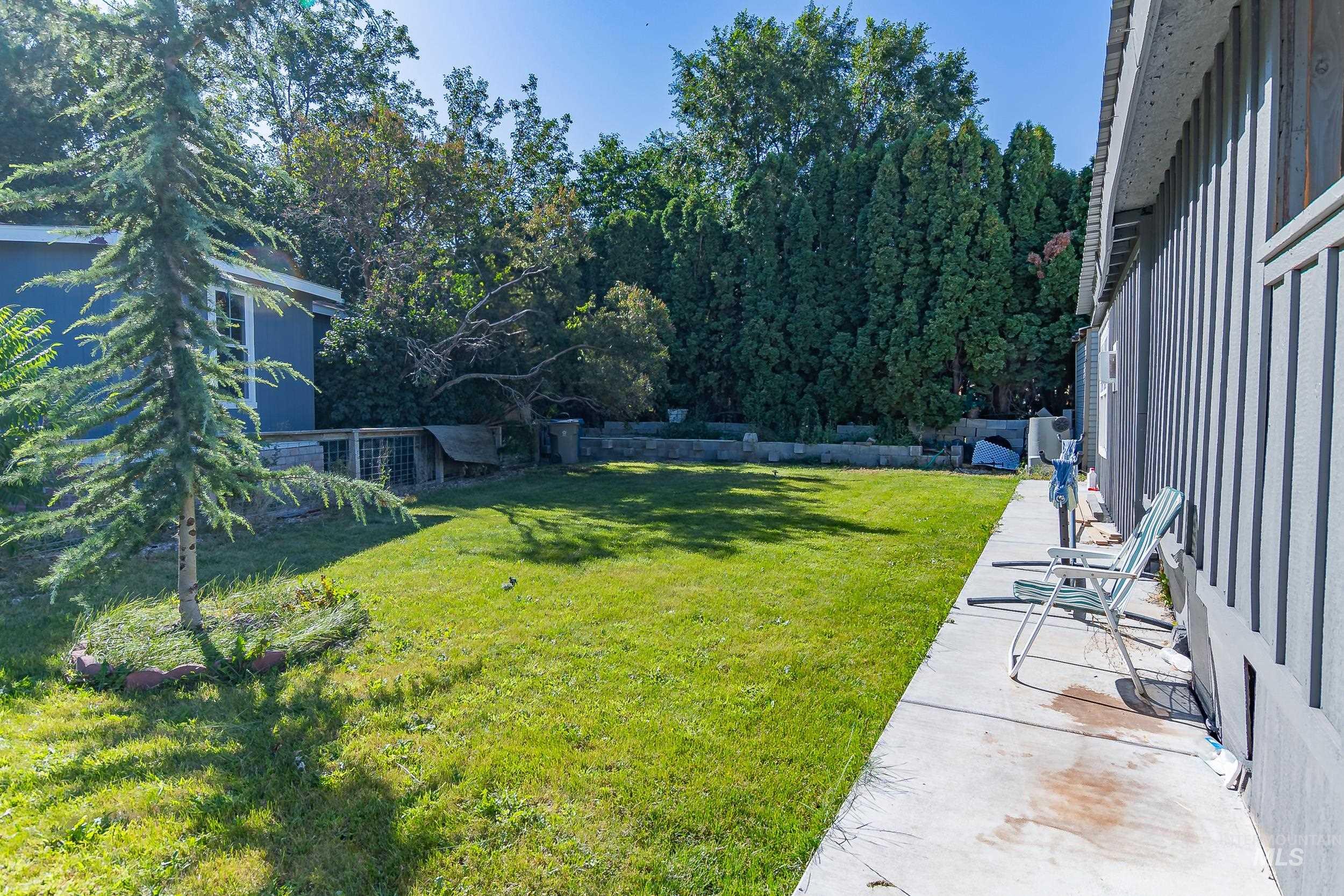 View of yard featuring view of scattered trees