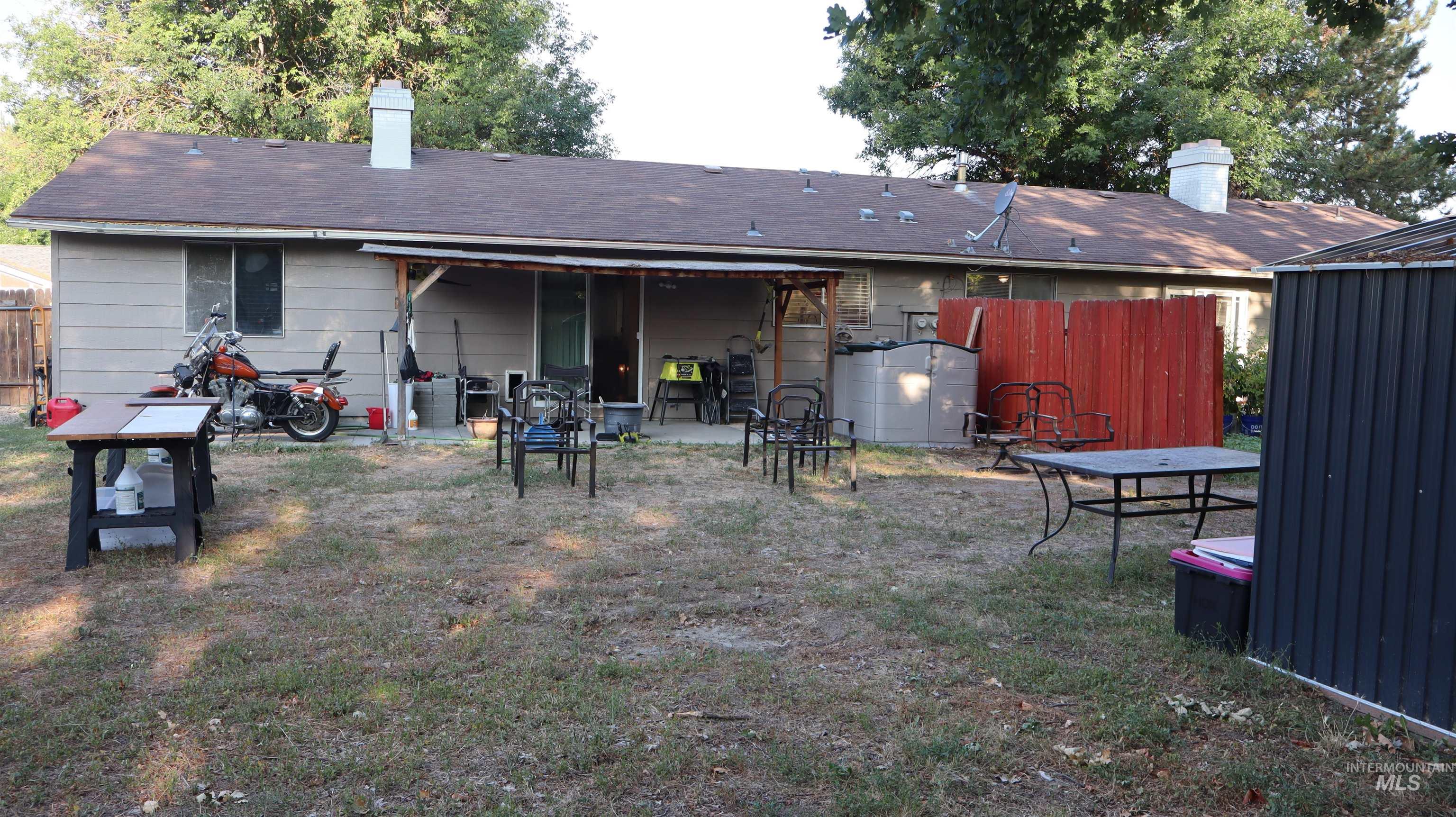 Rear view of property with a patio and a chimney