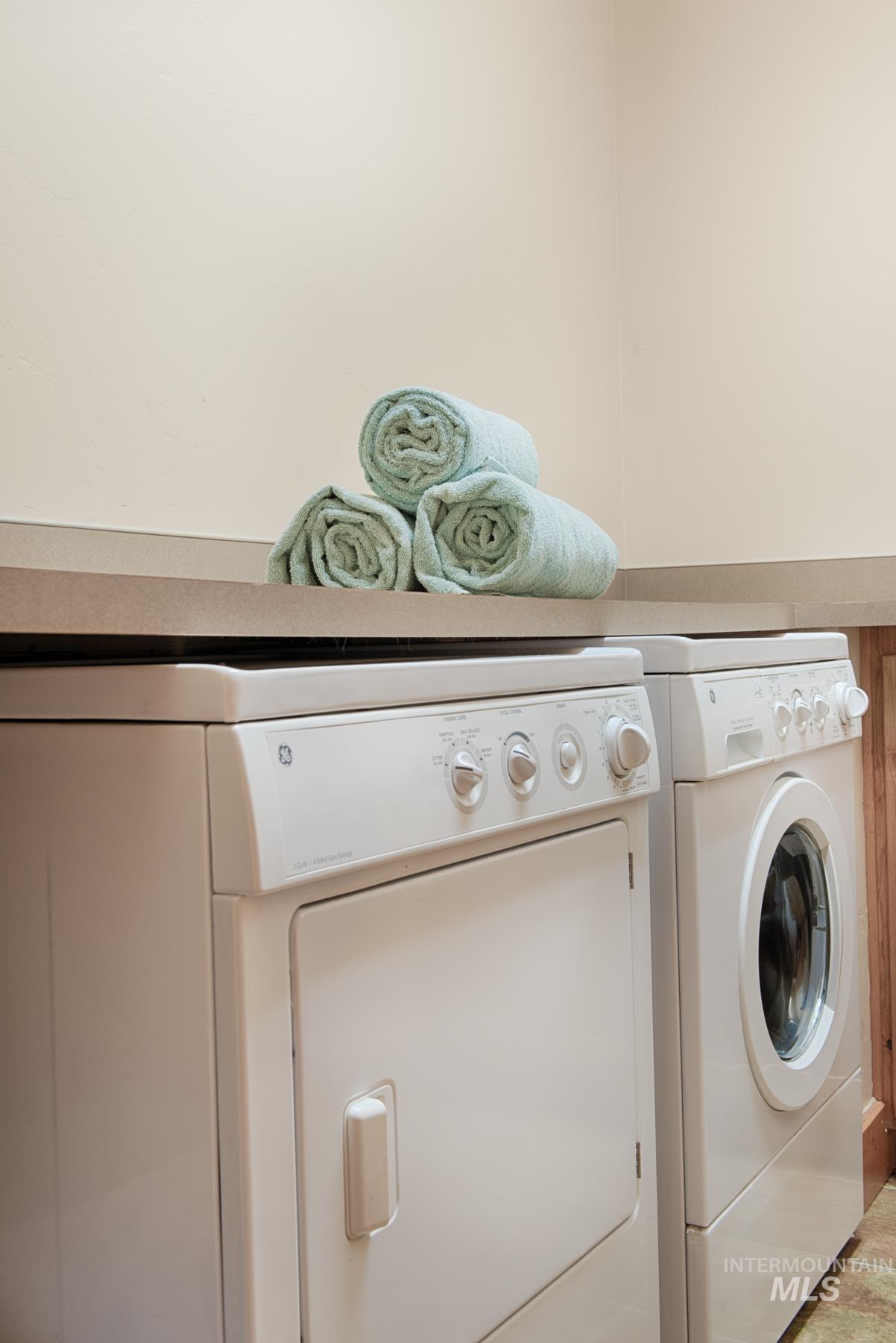 Laundry room featuring washer and clothes dryer