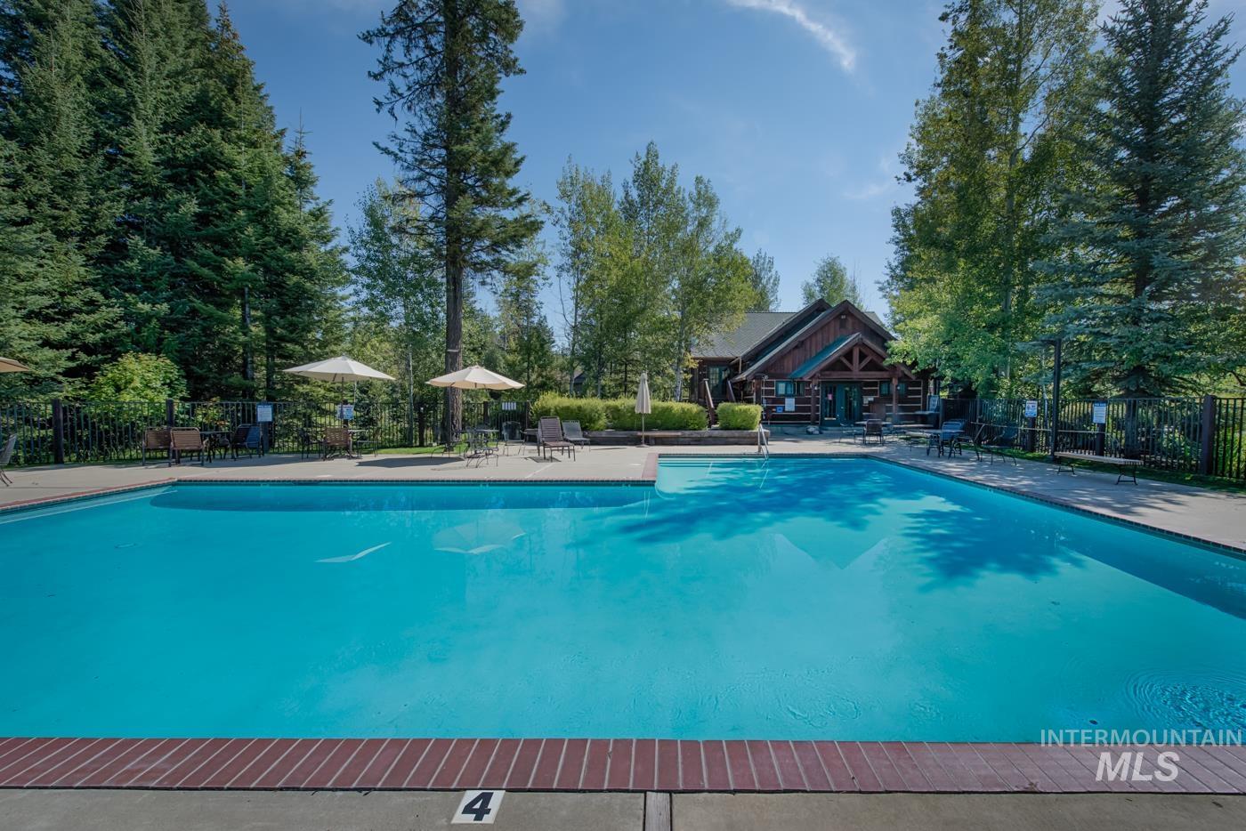 Community pool featuring a patio