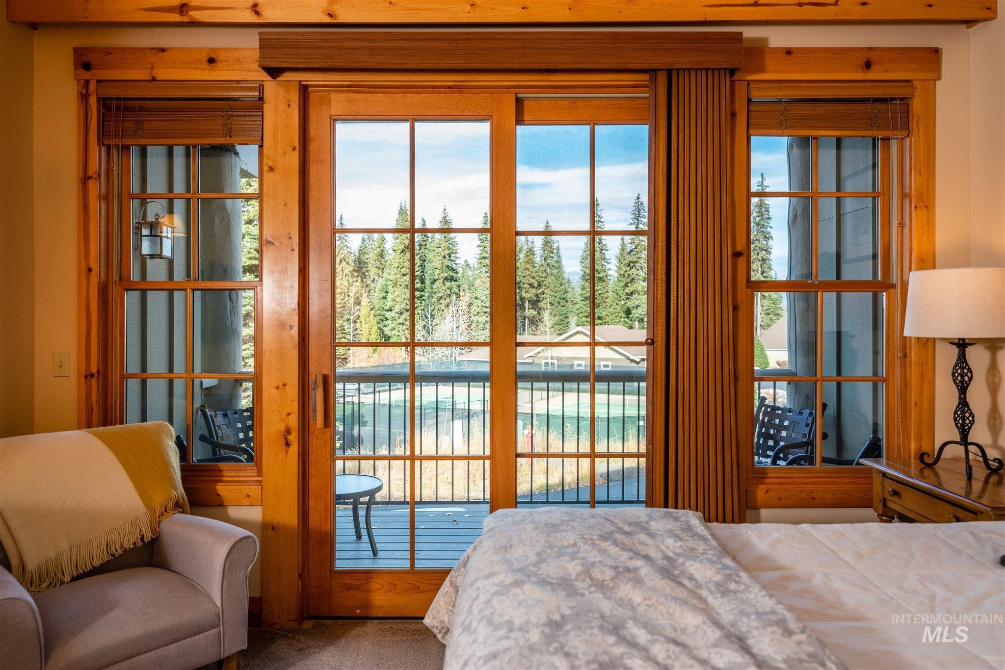 Bedroom featuring access to outside and carpet flooring