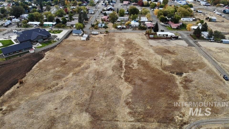 Aerial view of property's location featuring nearby suburban area