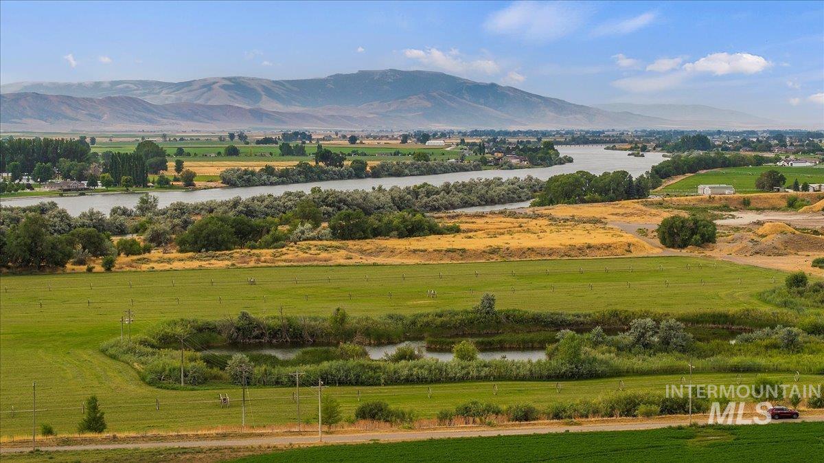 Mountain view with a large body of water and rural landscape