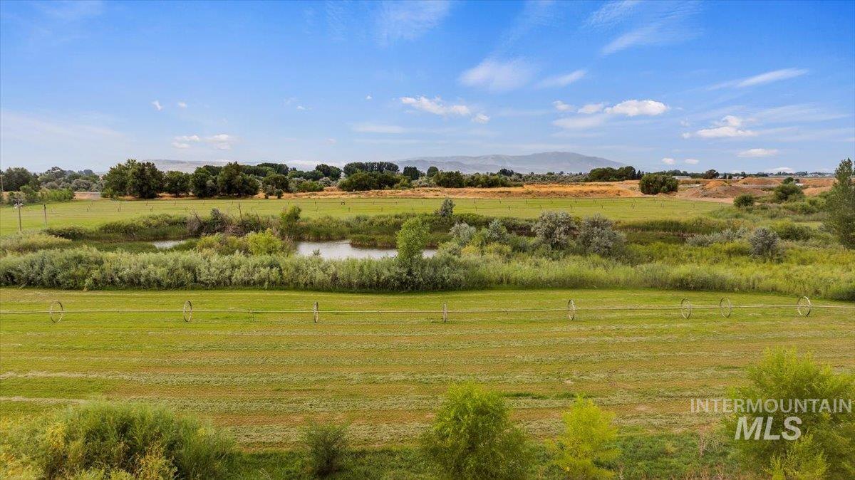 View of undeveloped land with a large body of water and rural landscape