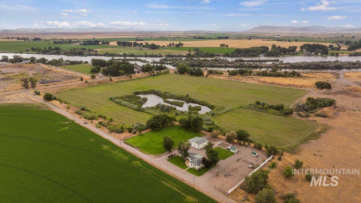 Aerial view of property's location featuring rural landscape and a large body of water