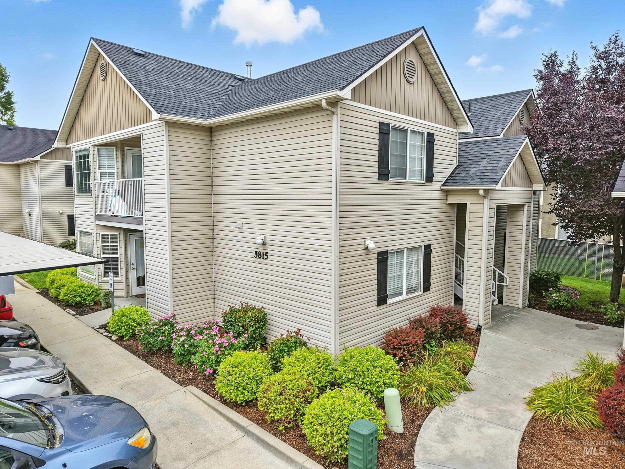 View of front of home featuring a shingled roof and board and batten siding