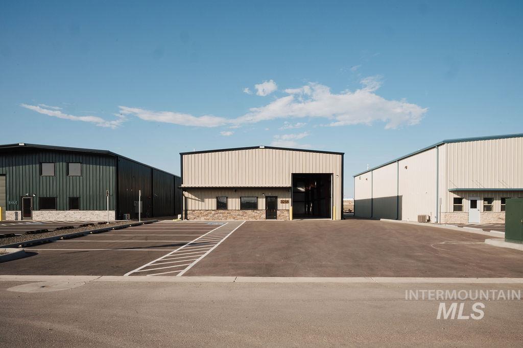 View of property with uncovered parking