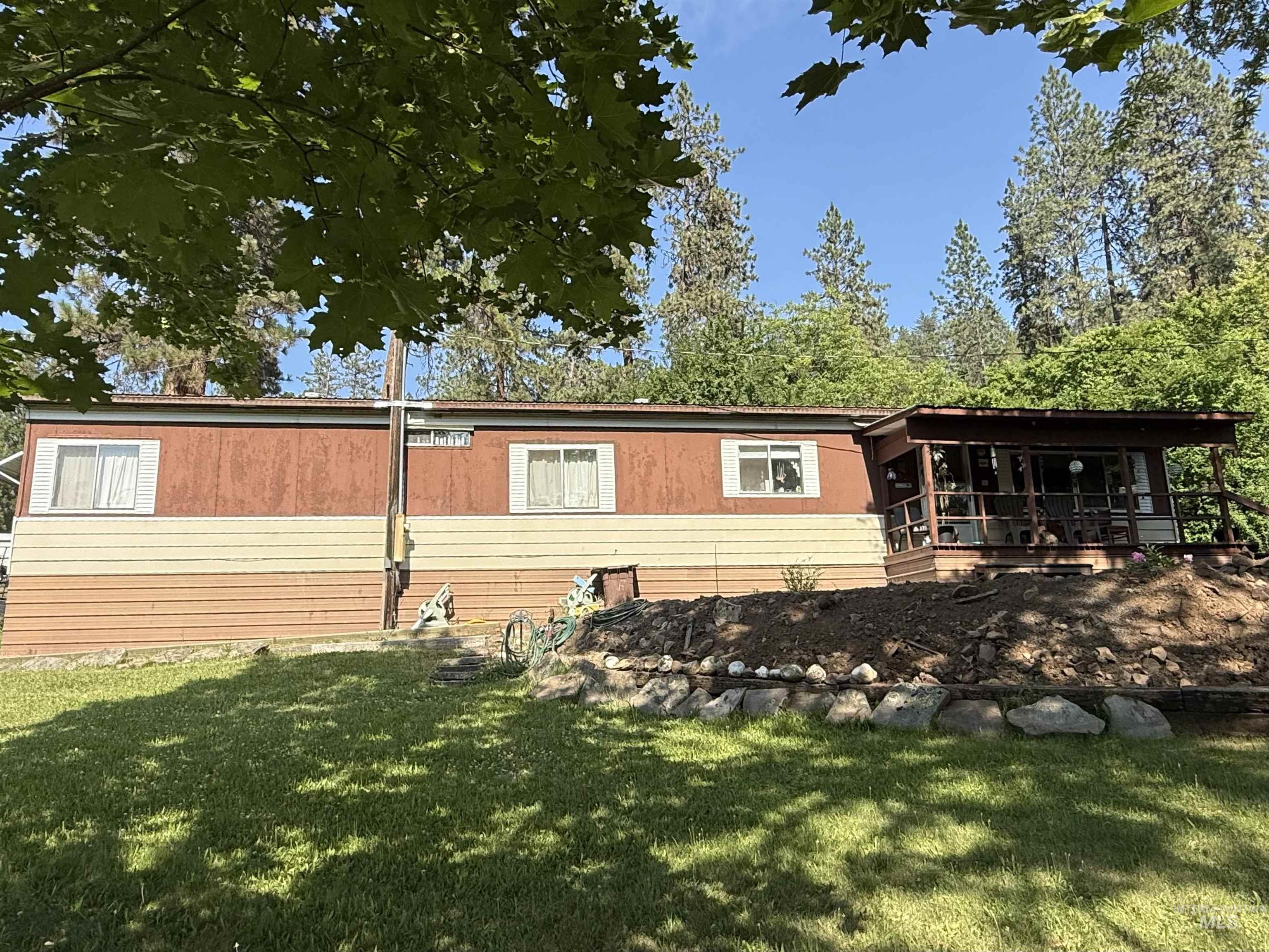 View of property exterior with a lawn