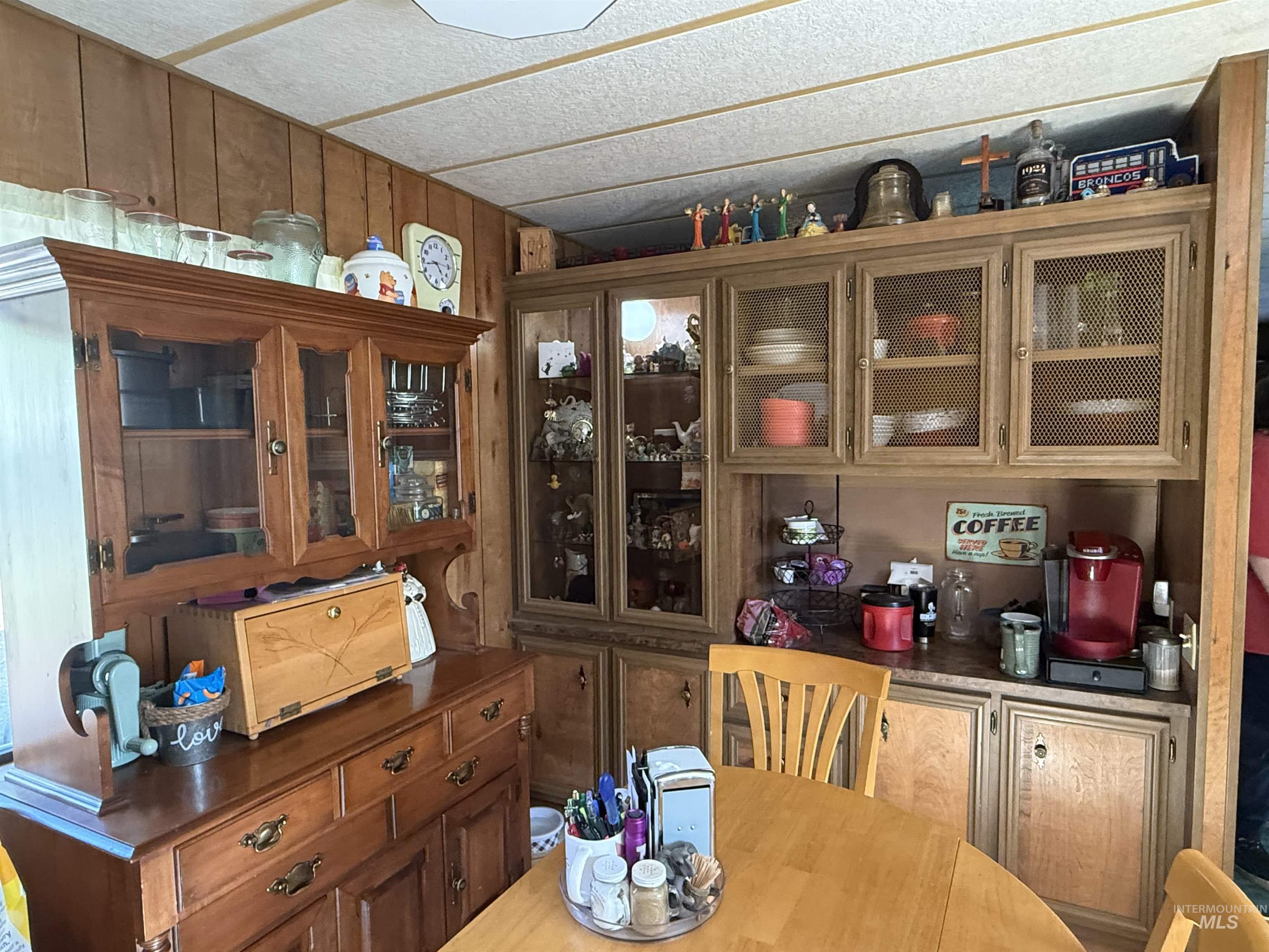 Dining room with wooden walls