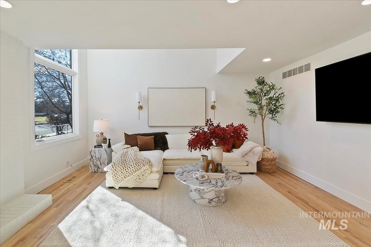 Living area featuring recessed lighting and wood finished floors