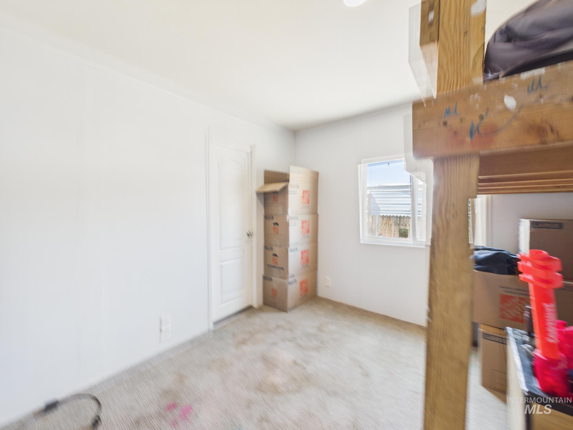Empty room featuring carpet flooring
