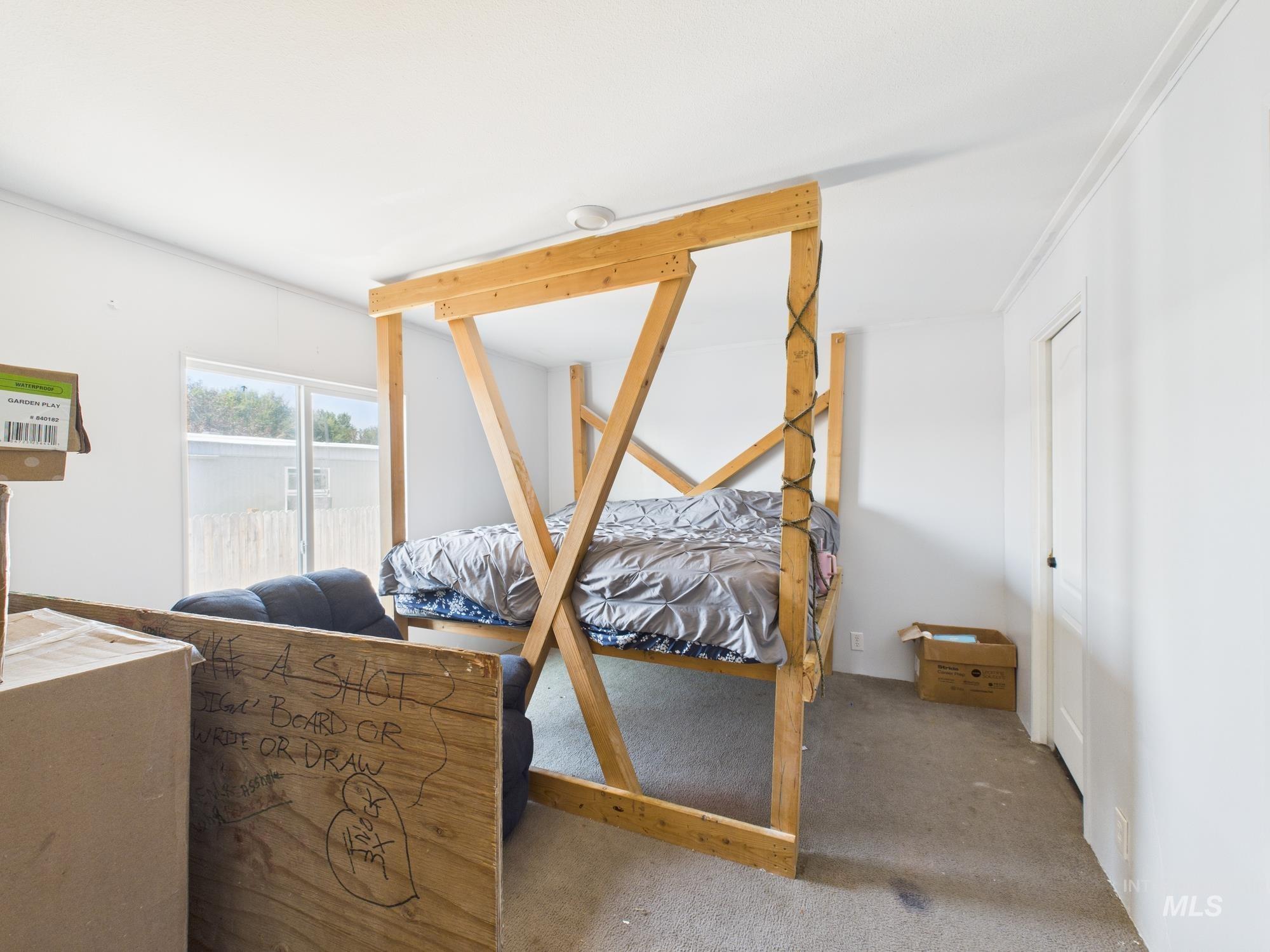 Bedroom with carpet and ornamental molding
