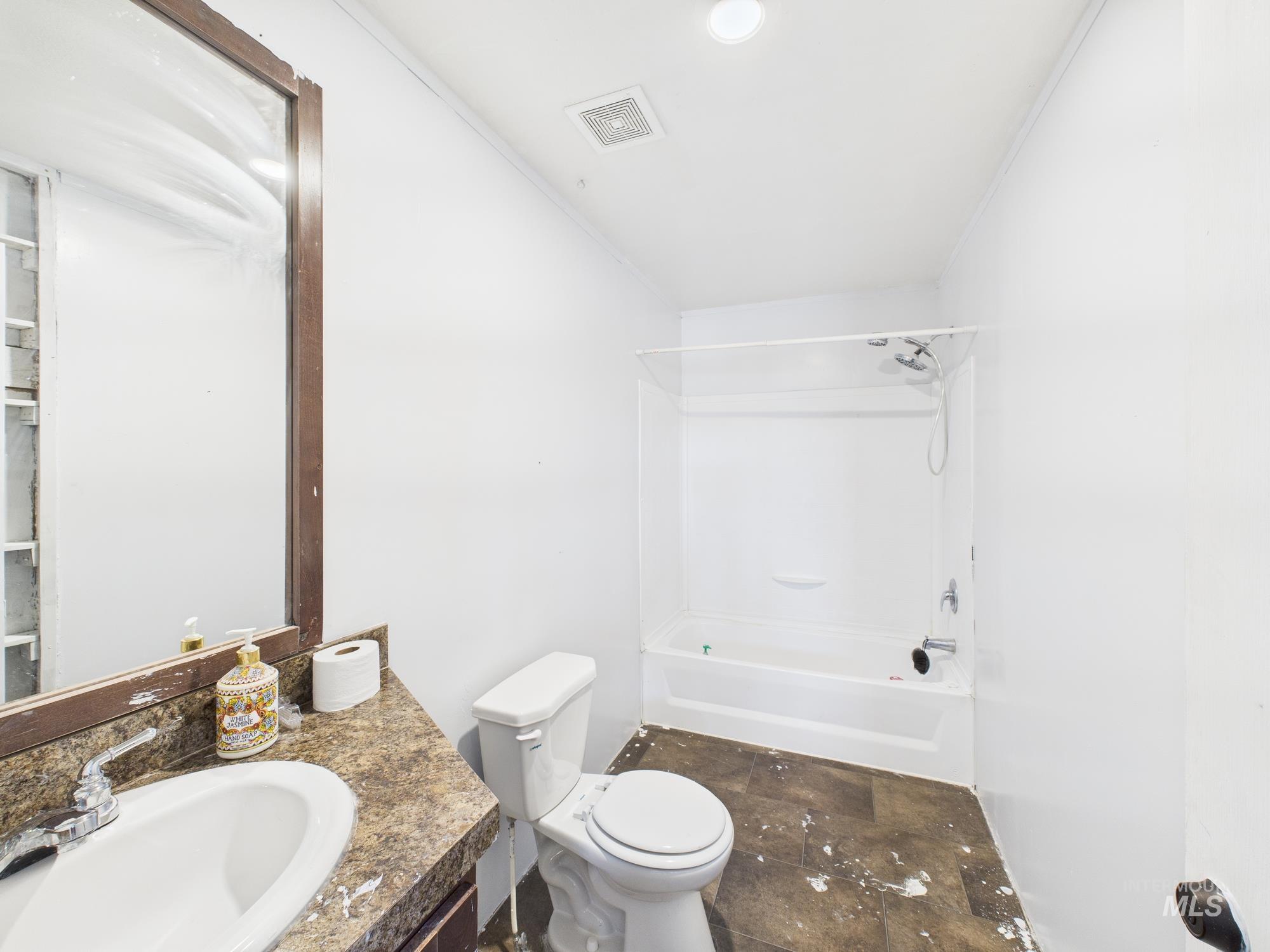 Bathroom with shower / bath combination and vanity