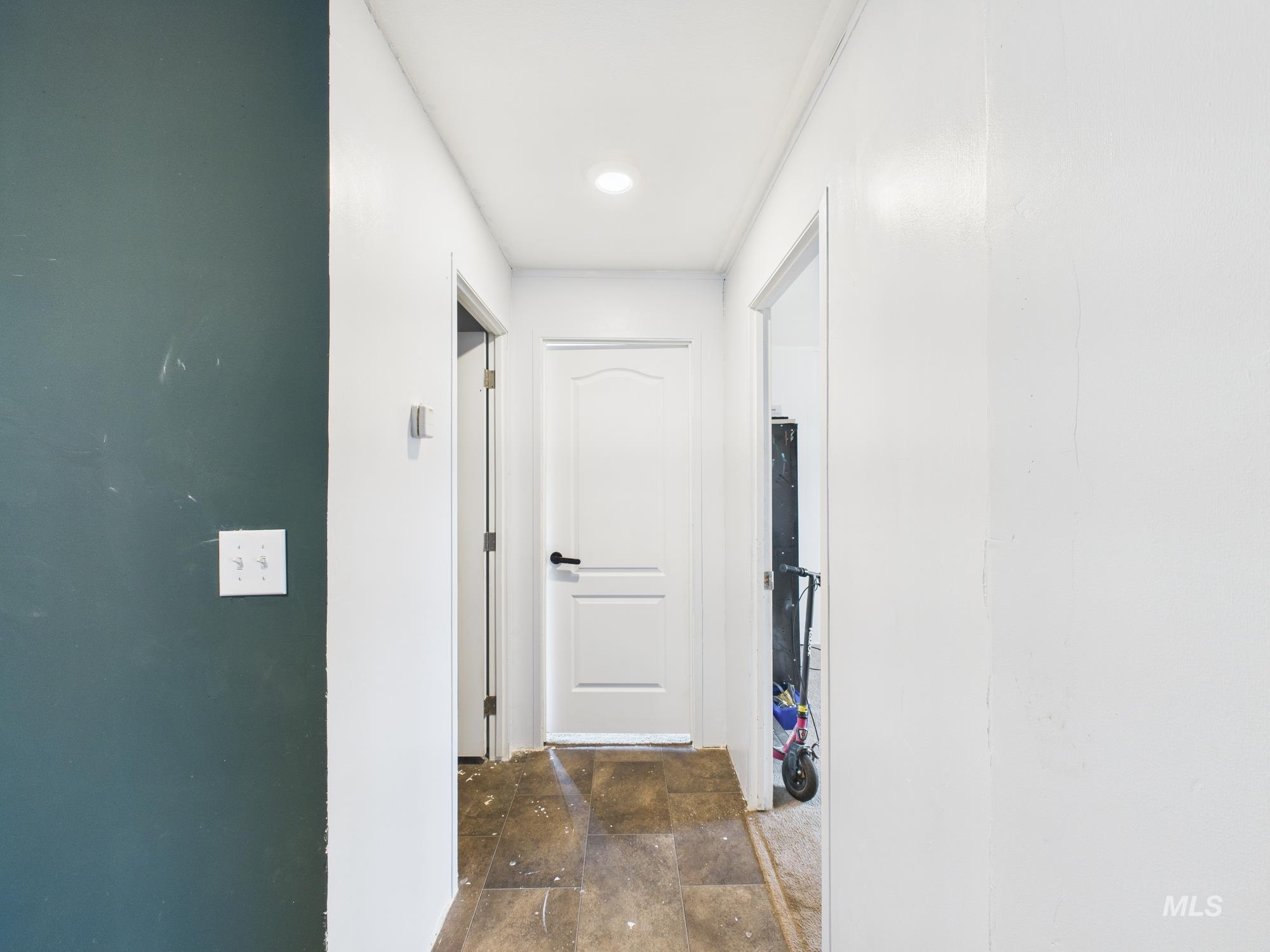 Corridor with dark stone finish floors