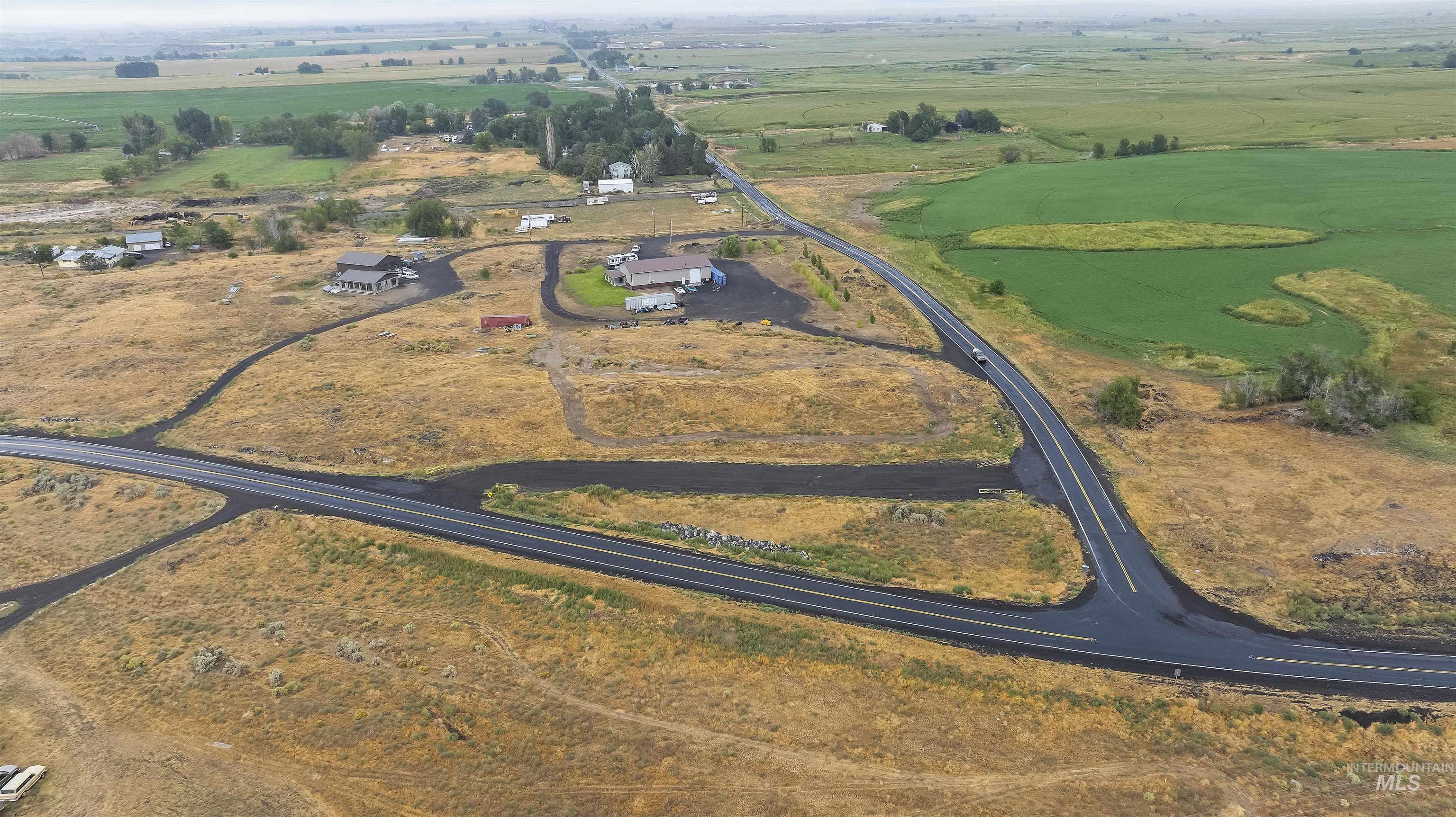 Aerial view of property and surrounding area with rural landscape