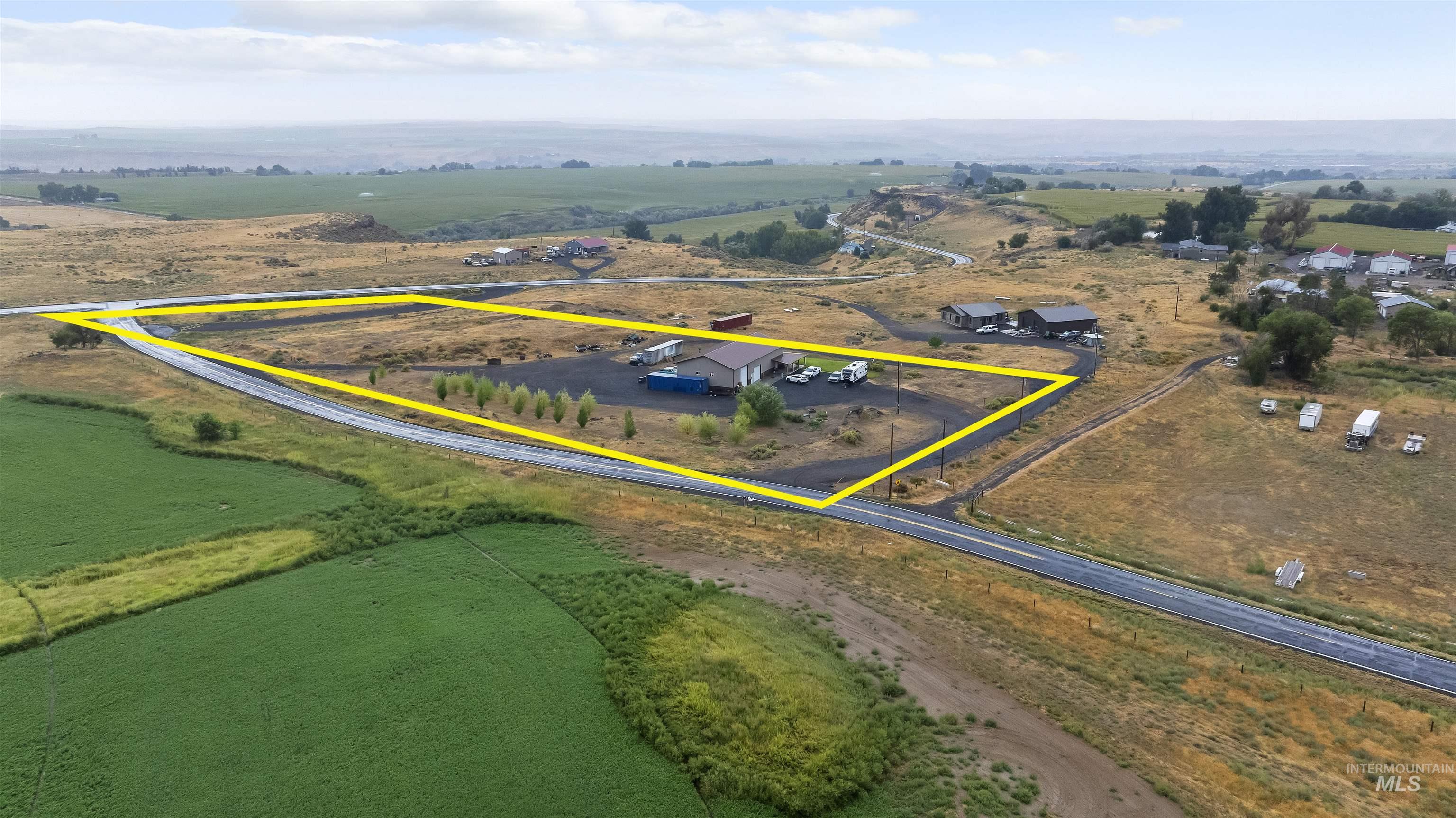 Aerial view of sparsely populated area featuring property parcel outlined