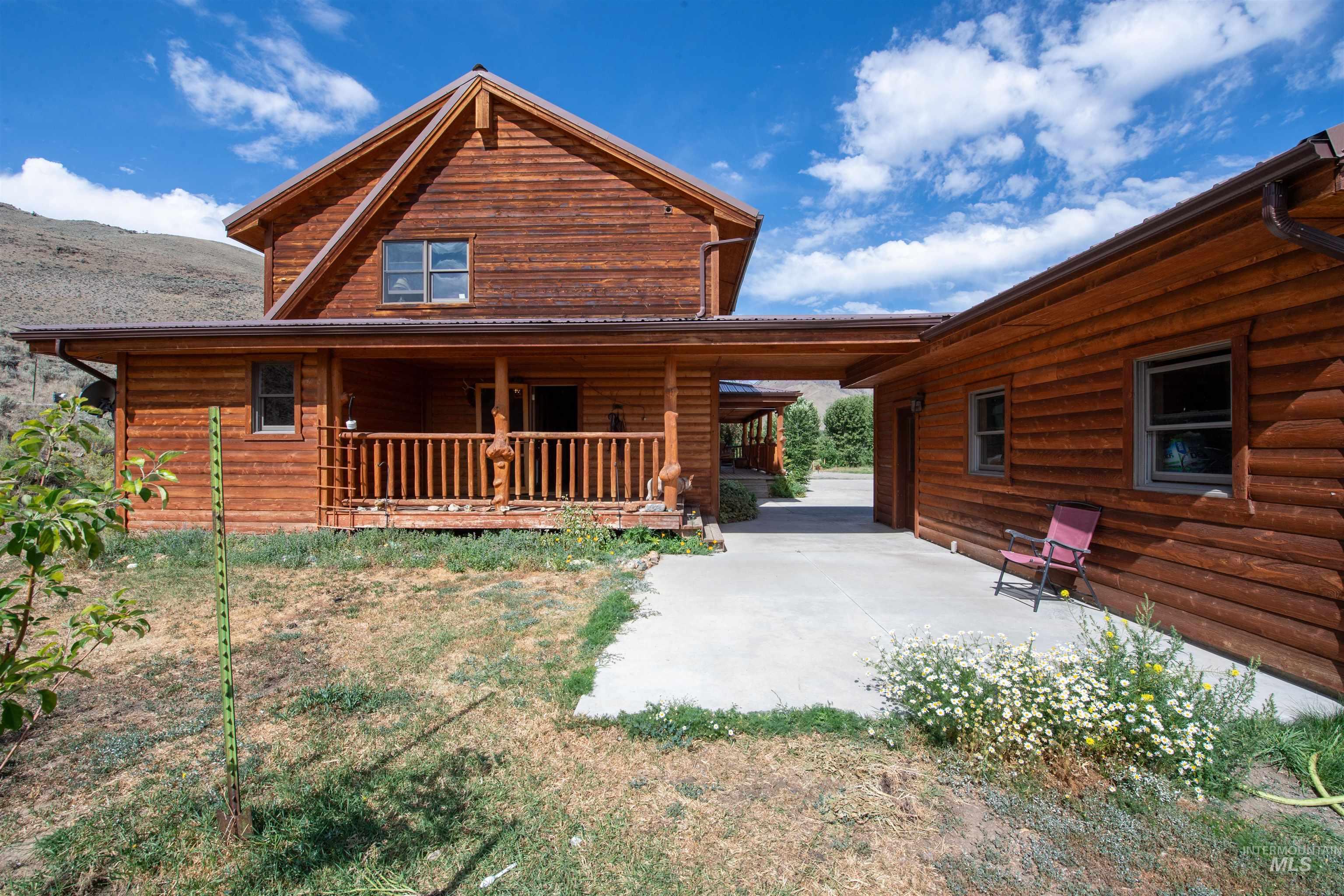 Back of property with covered porch