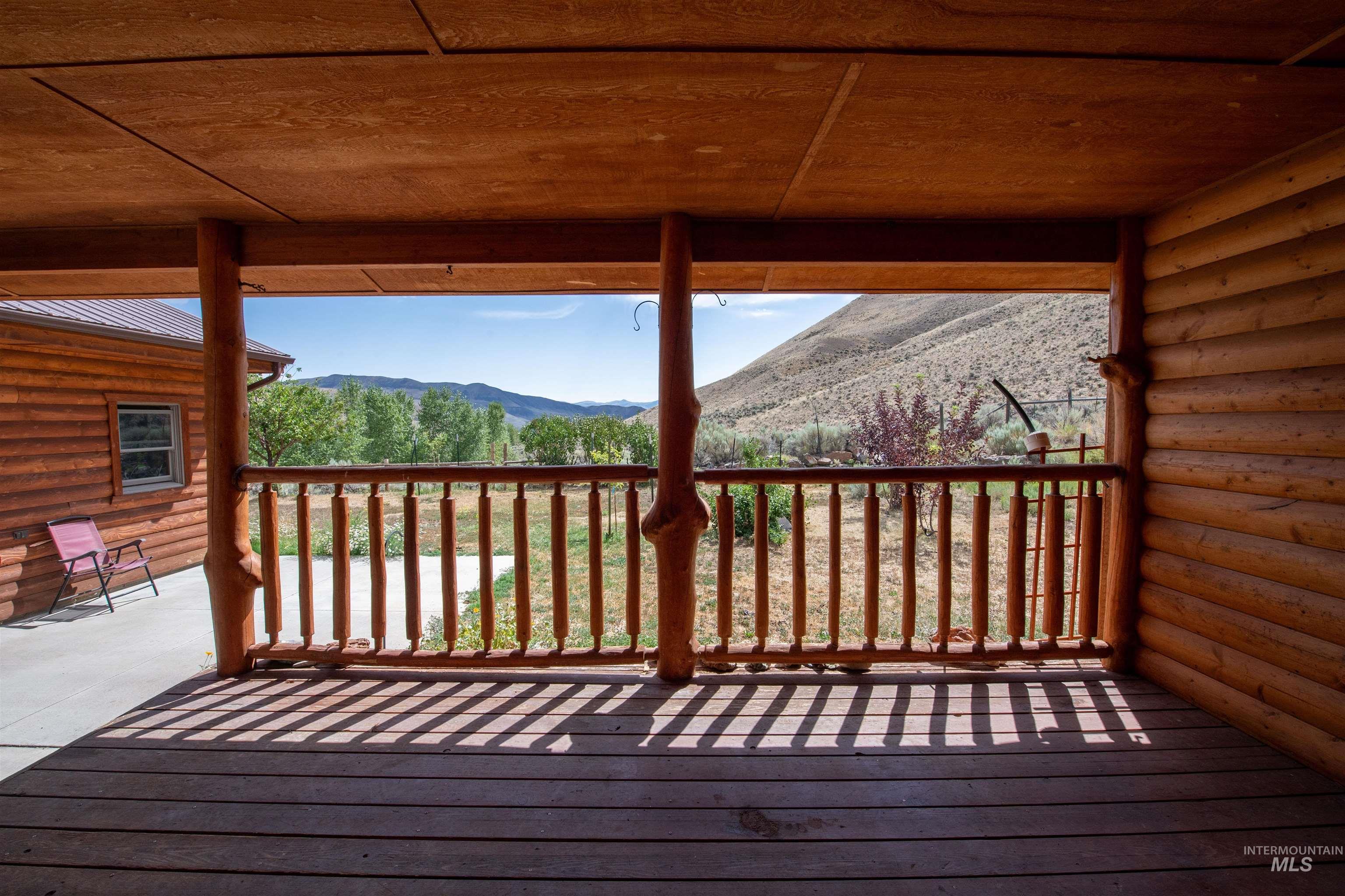 Wooden terrace featuring a mountain view