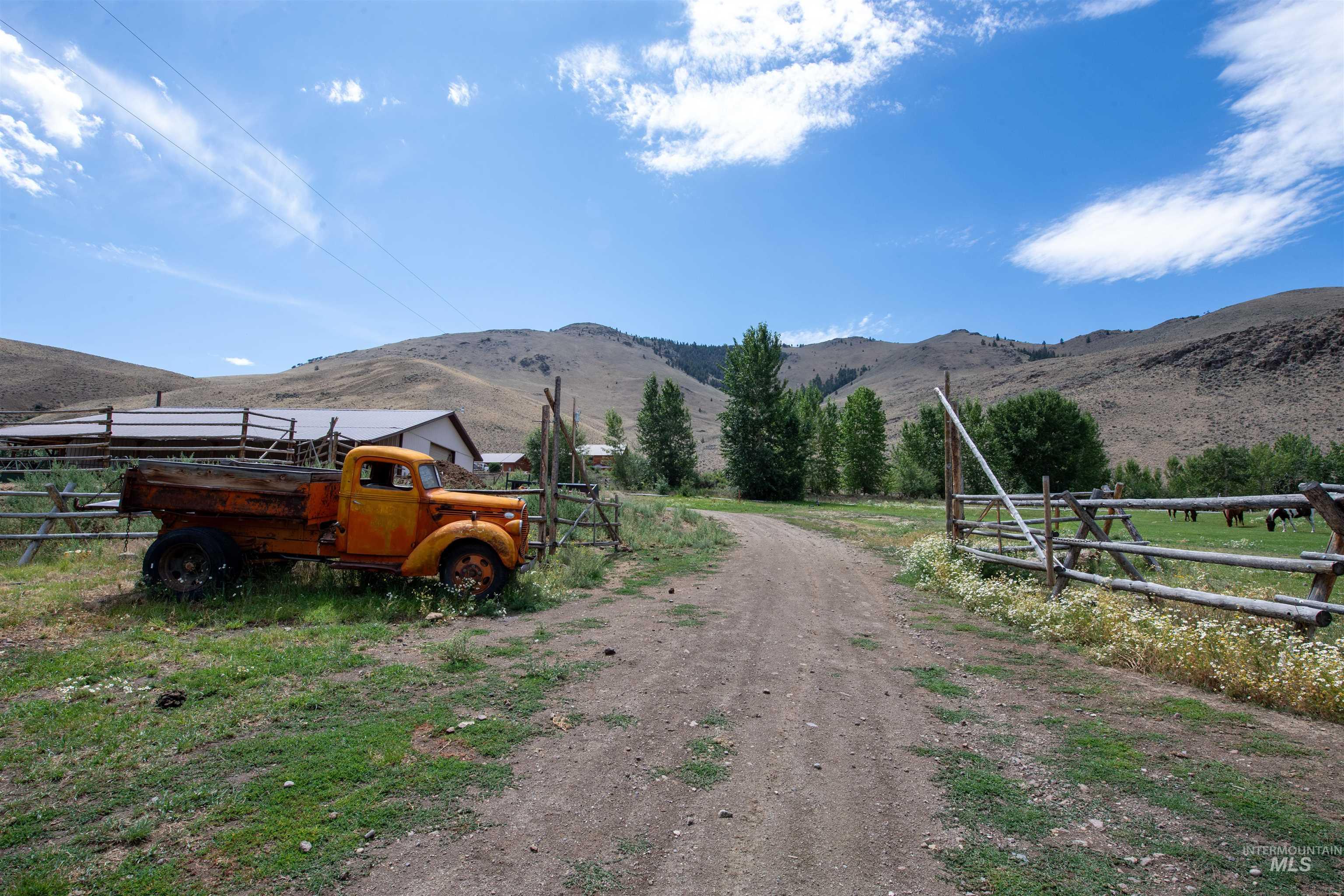 View of road featuring a mountain view and a view of rural / pastoral area