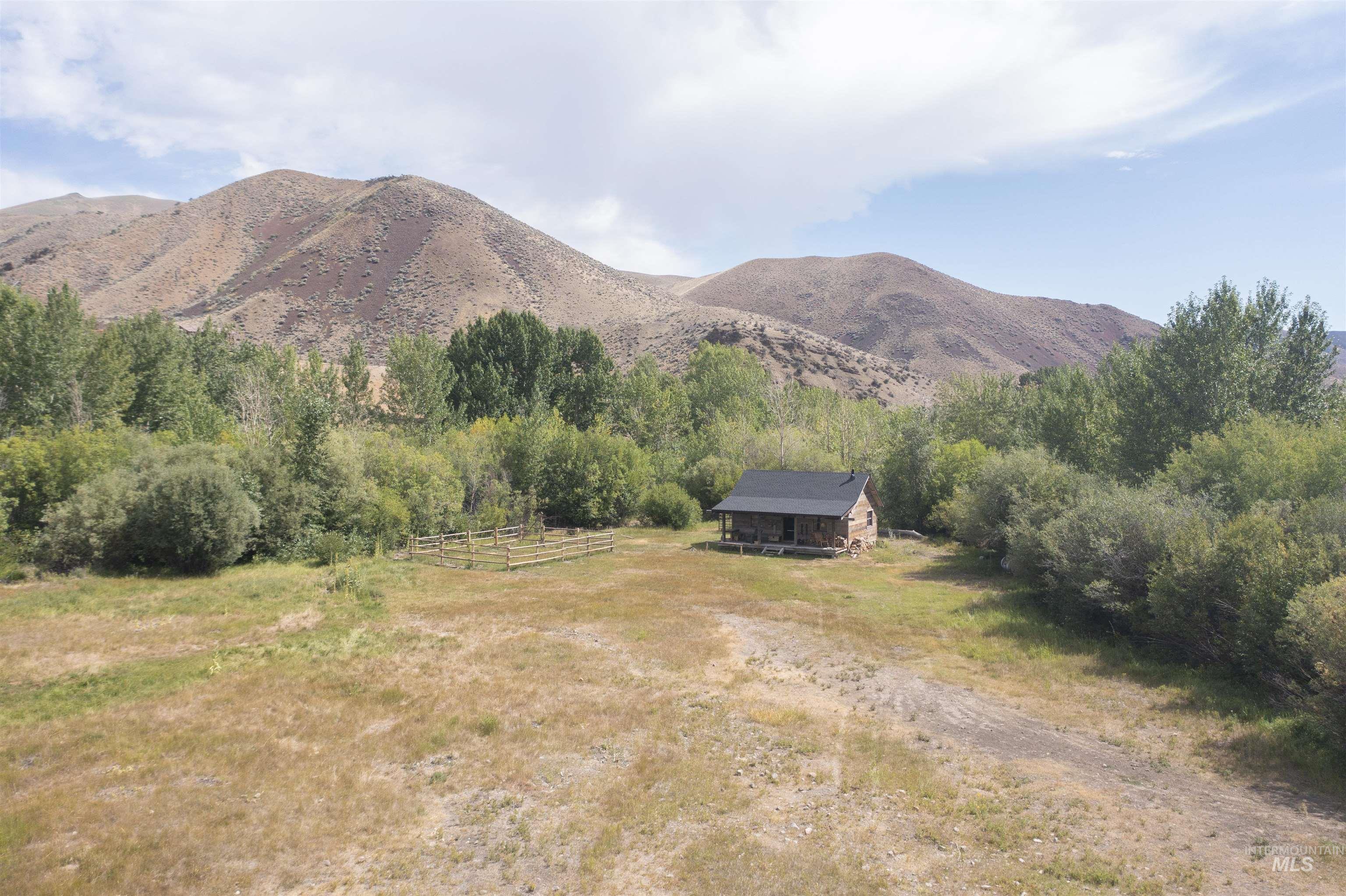 View of mountain background featuring rural landscape
