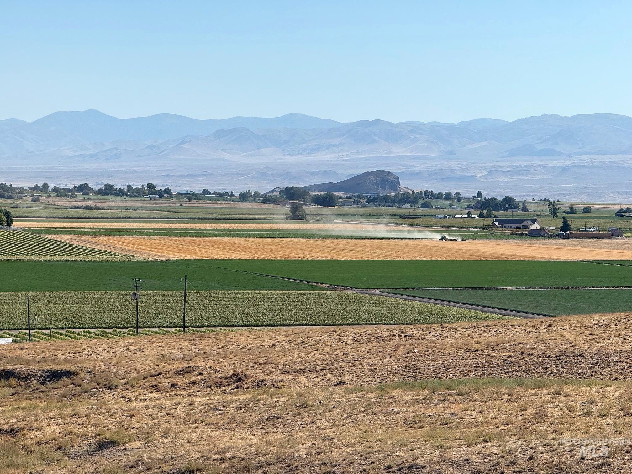 Surrounding community featuring agricultural area, a mountain view, and a rural view