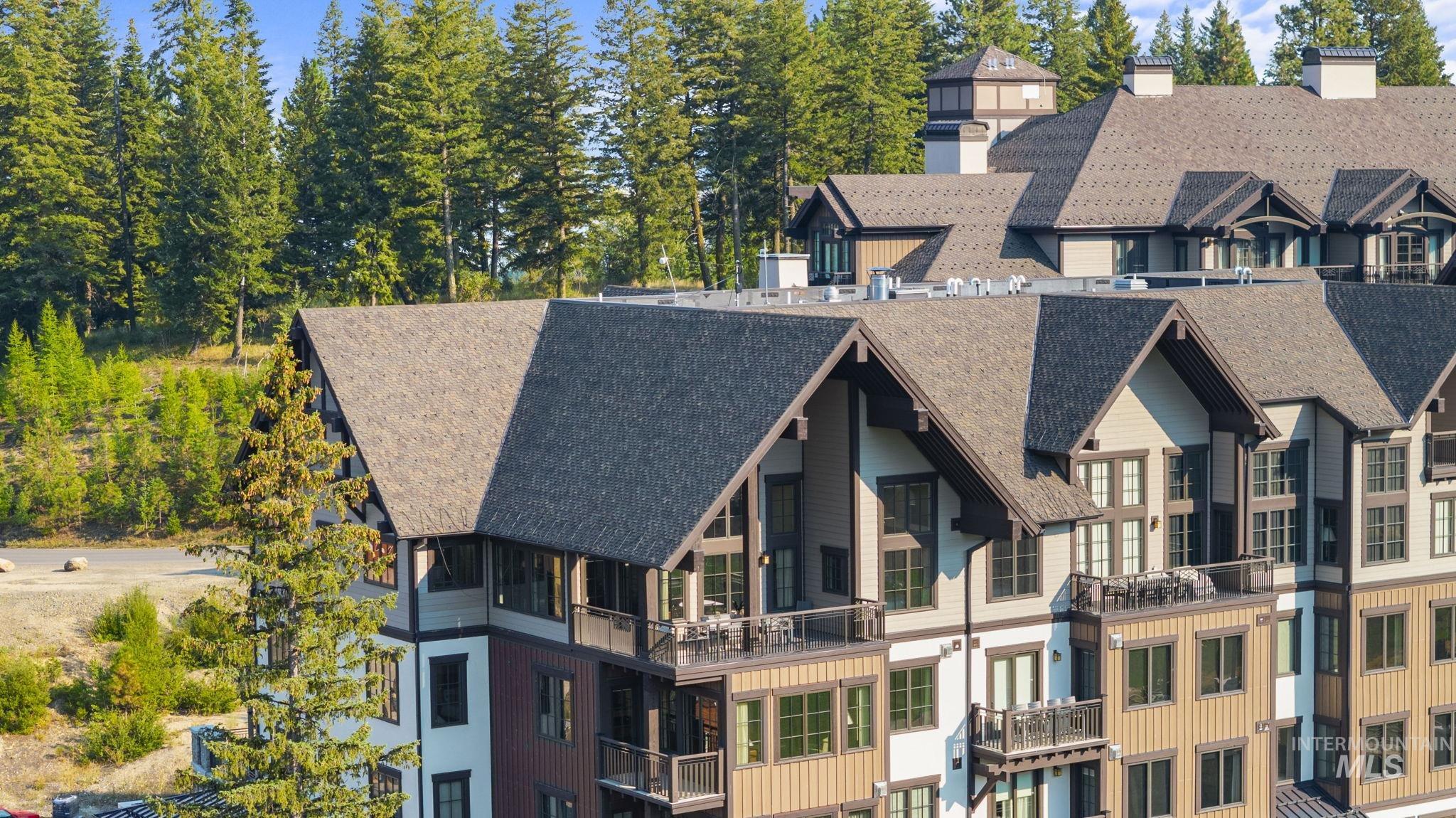 Back of property with a balcony