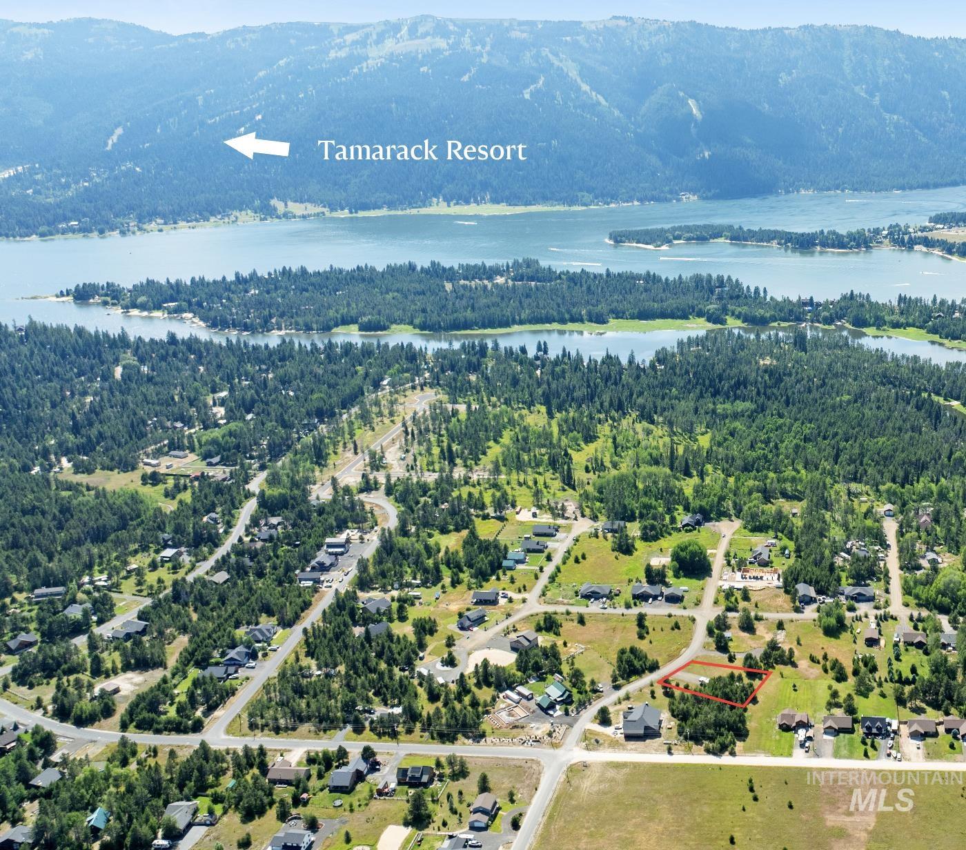 View of property location featuring a water and mountain view and property boundaries highlighted