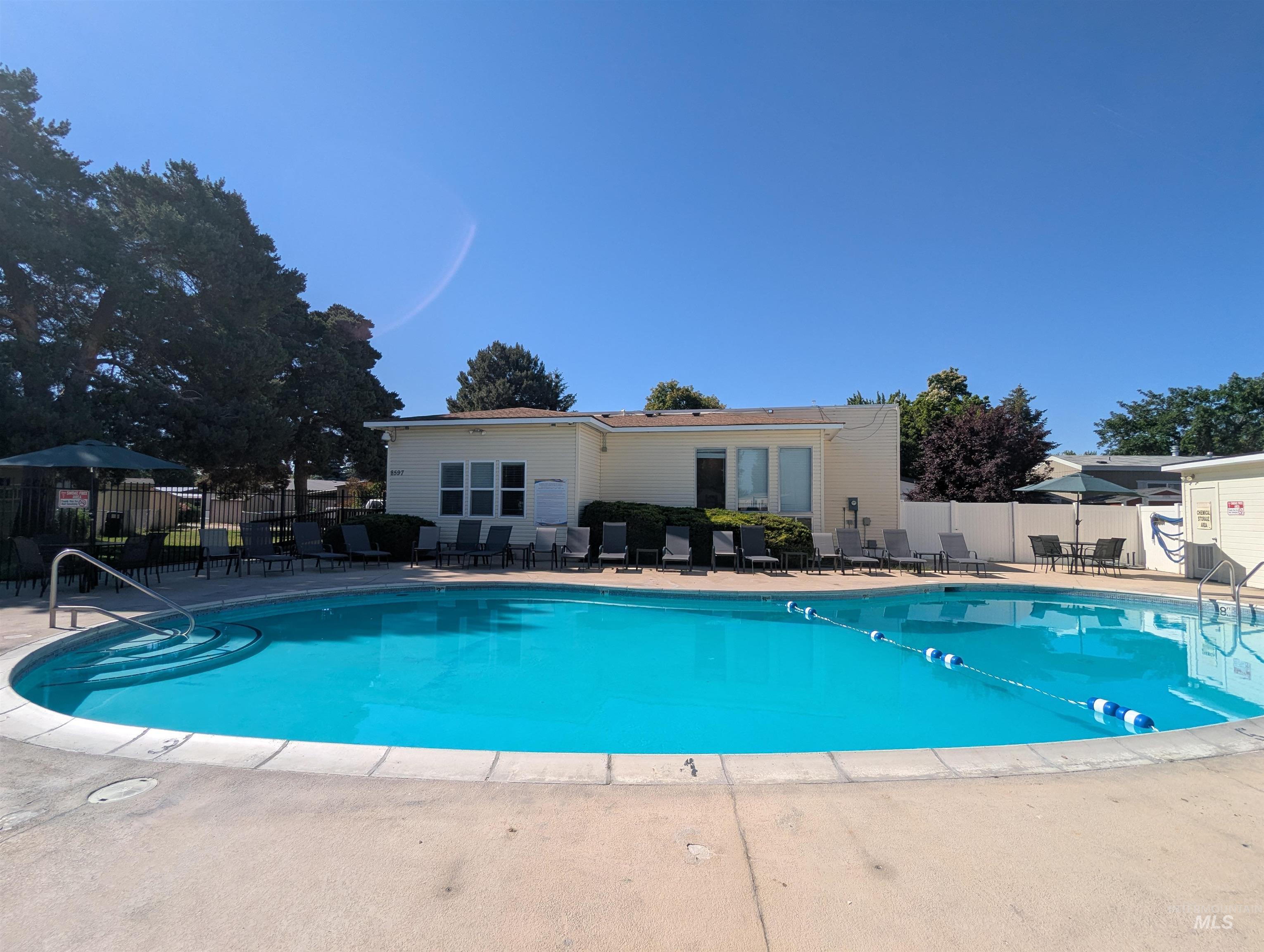 Community pool featuring a patio area