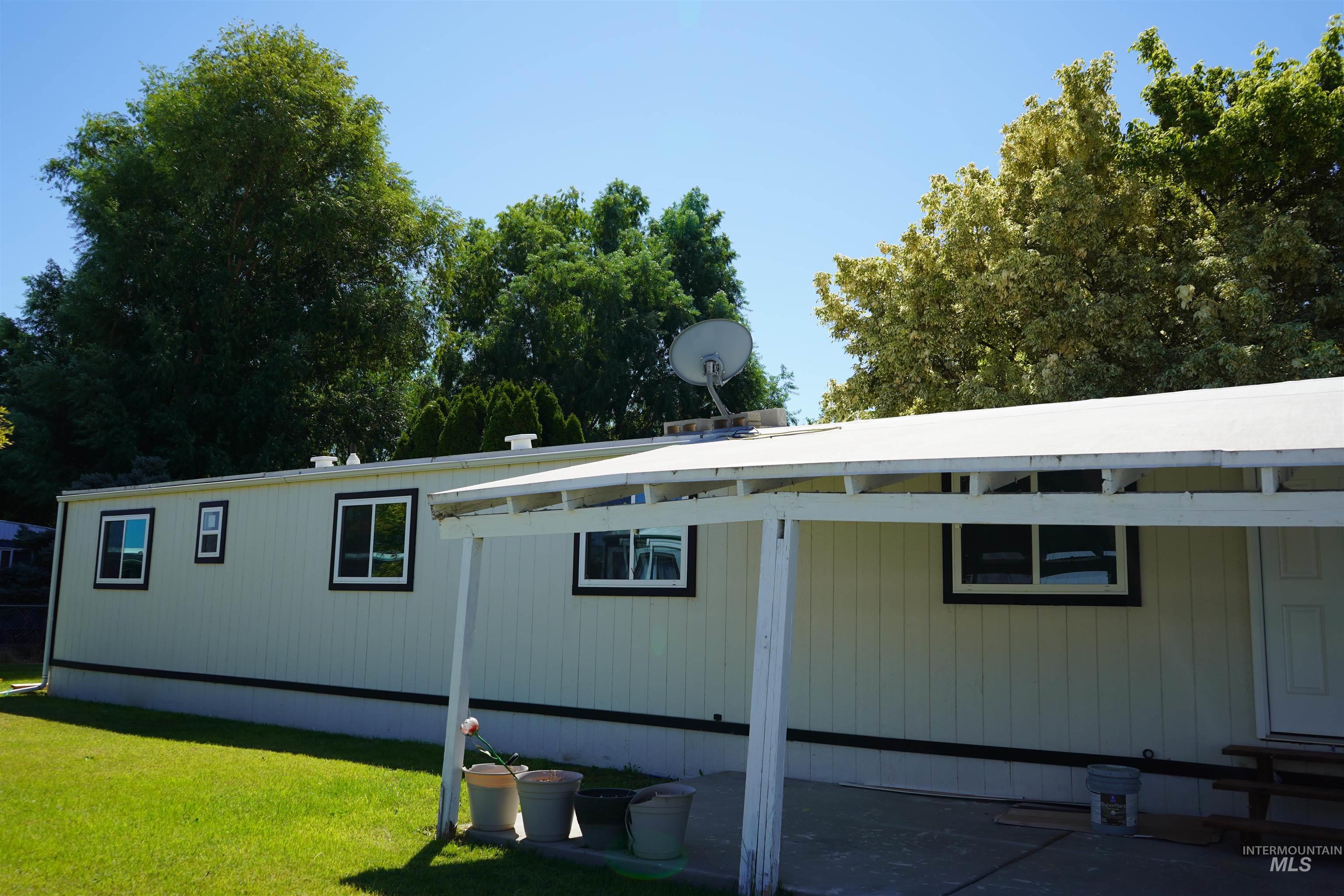 View of property exterior featuring a yard
