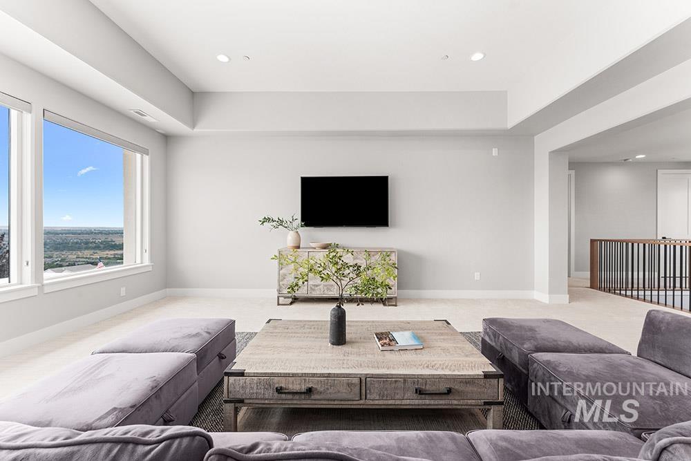 Living area with carpet and recessed lighting