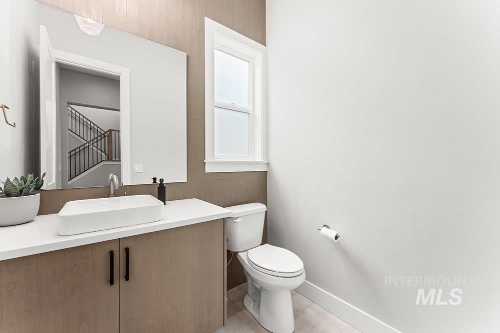 Bathroom with vanity and light tile patterned floors